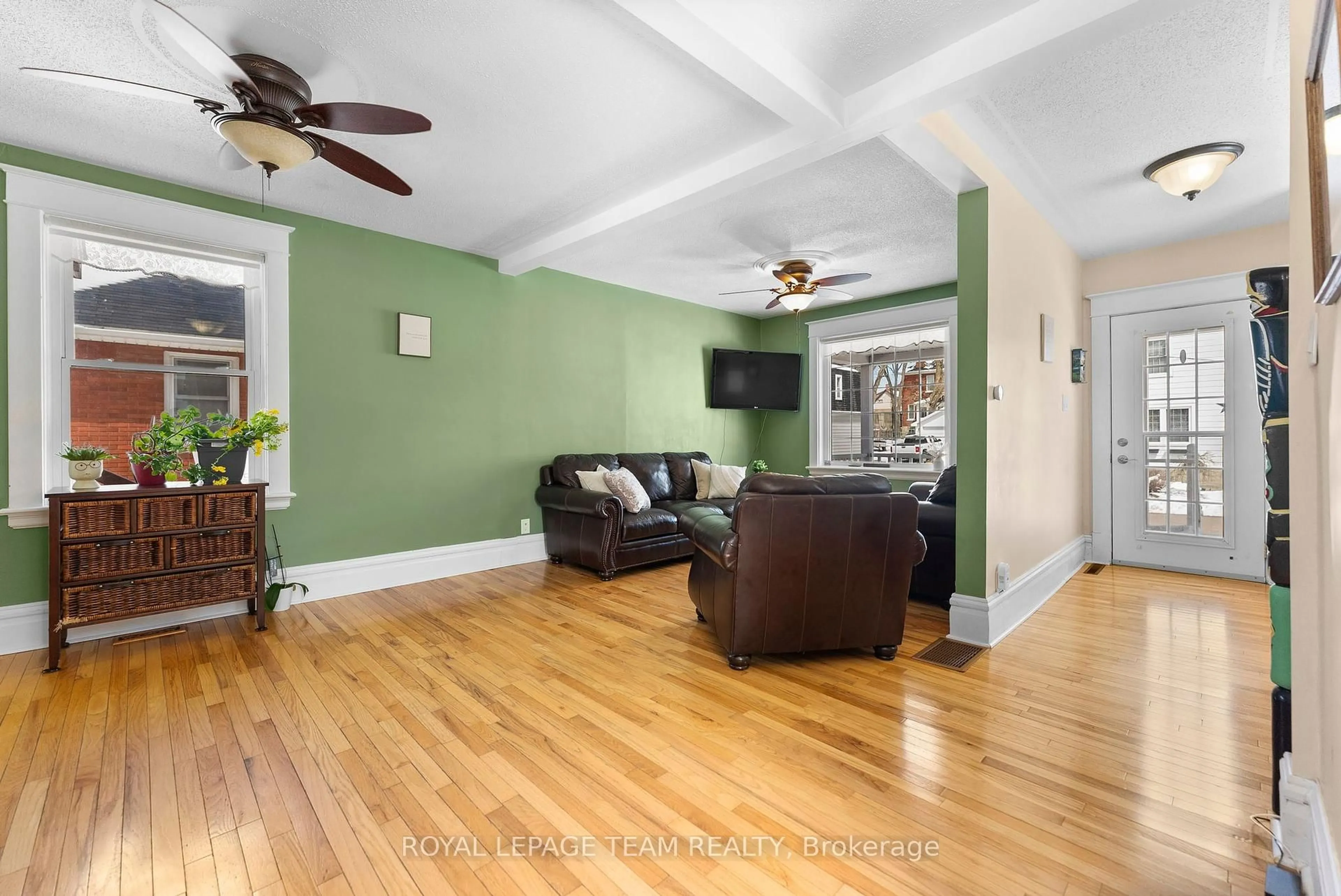 Living room with furniture, wood/laminate floor for 28 Bank St, Renfrew Ontario K7V 2C9