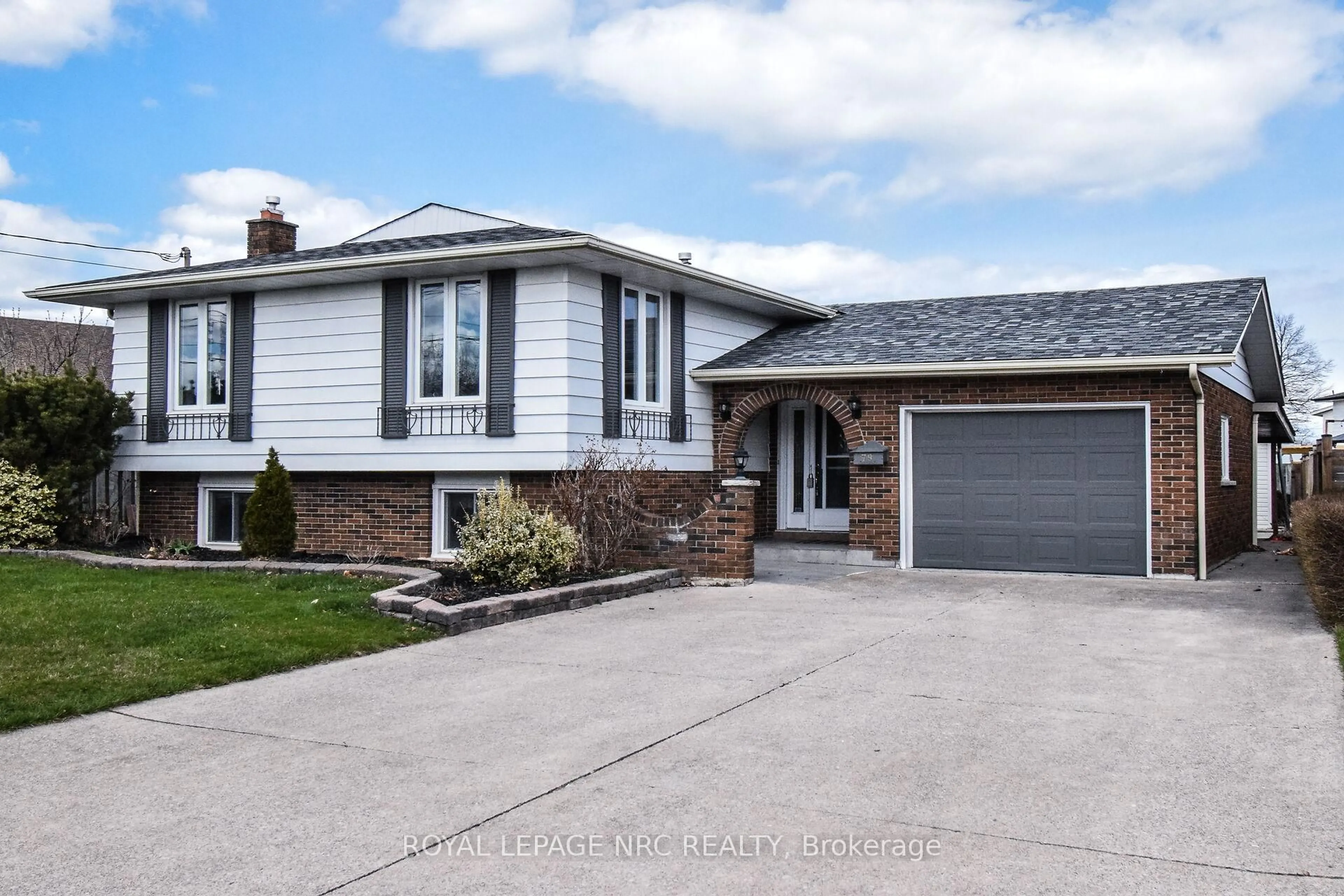 Home with vinyl exterior material, street for 79 Sherman Dr, St. Catharines Ontario L2N 2L6