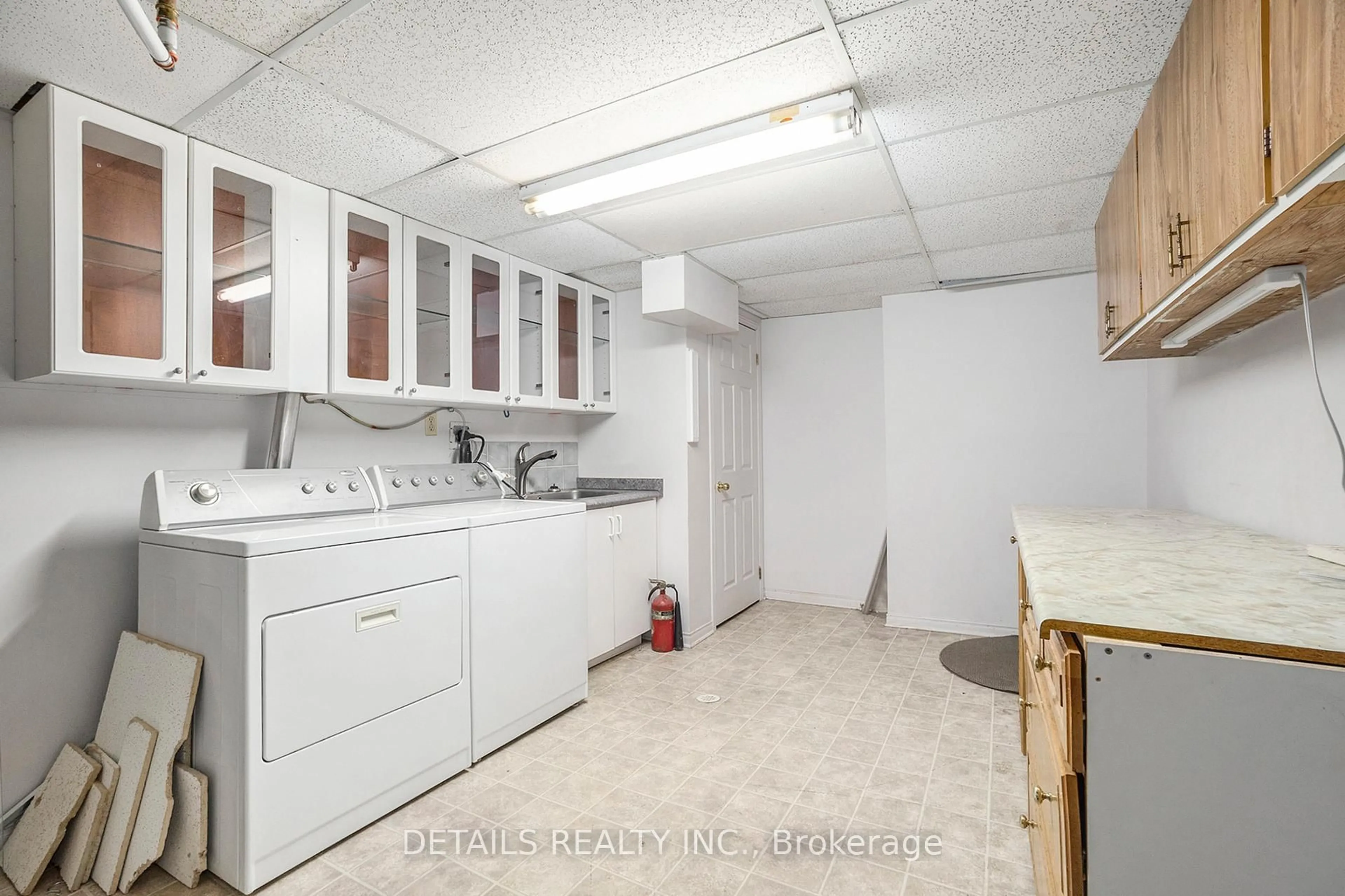 Kitchen with laundary machines, unknown for 395 Hatfield Cres, Ottawa Ontario K1E 1M6
