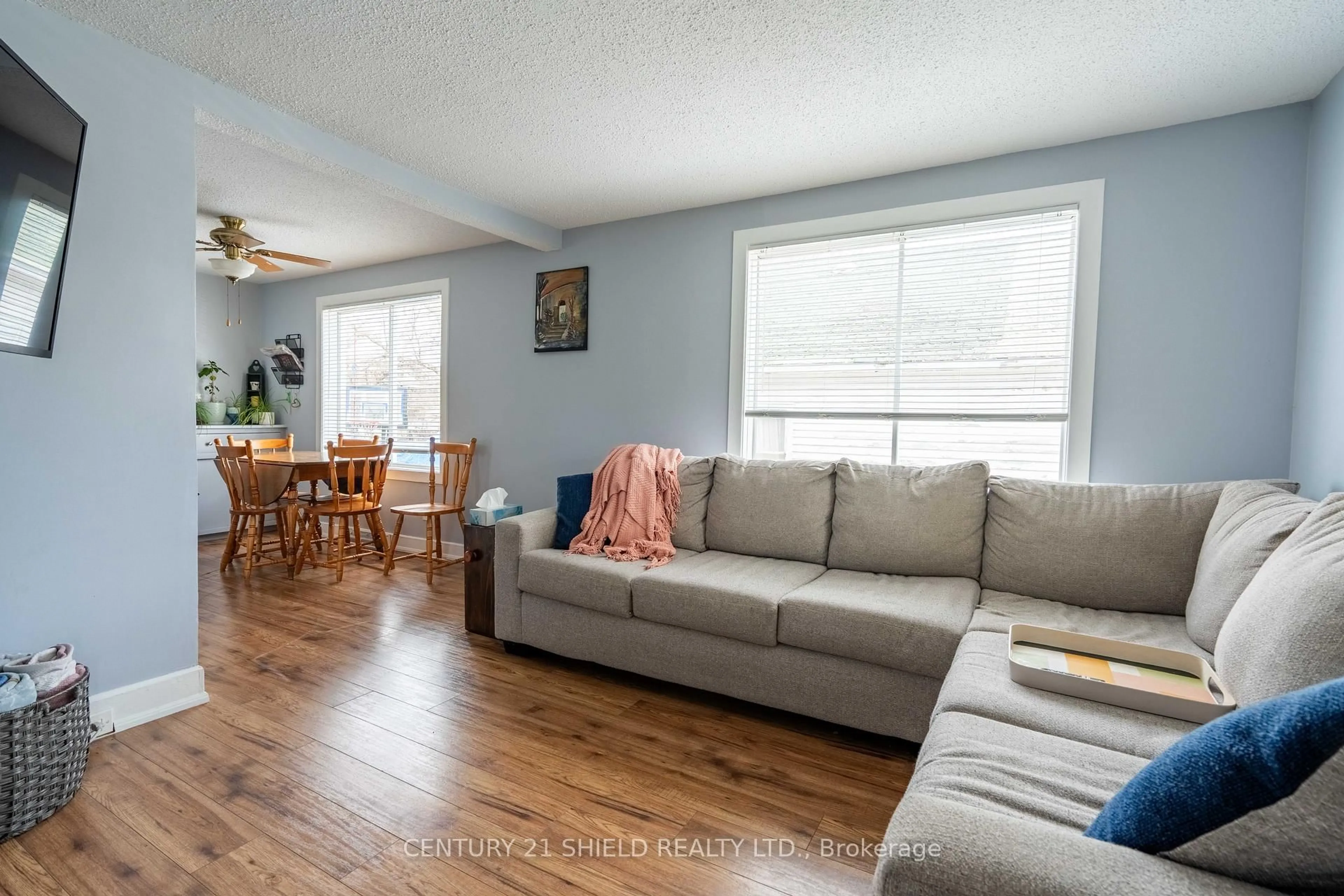 Living room with furniture, wood/laminate floor for 31 5th St, Cornwall Ontario K6J 2T5