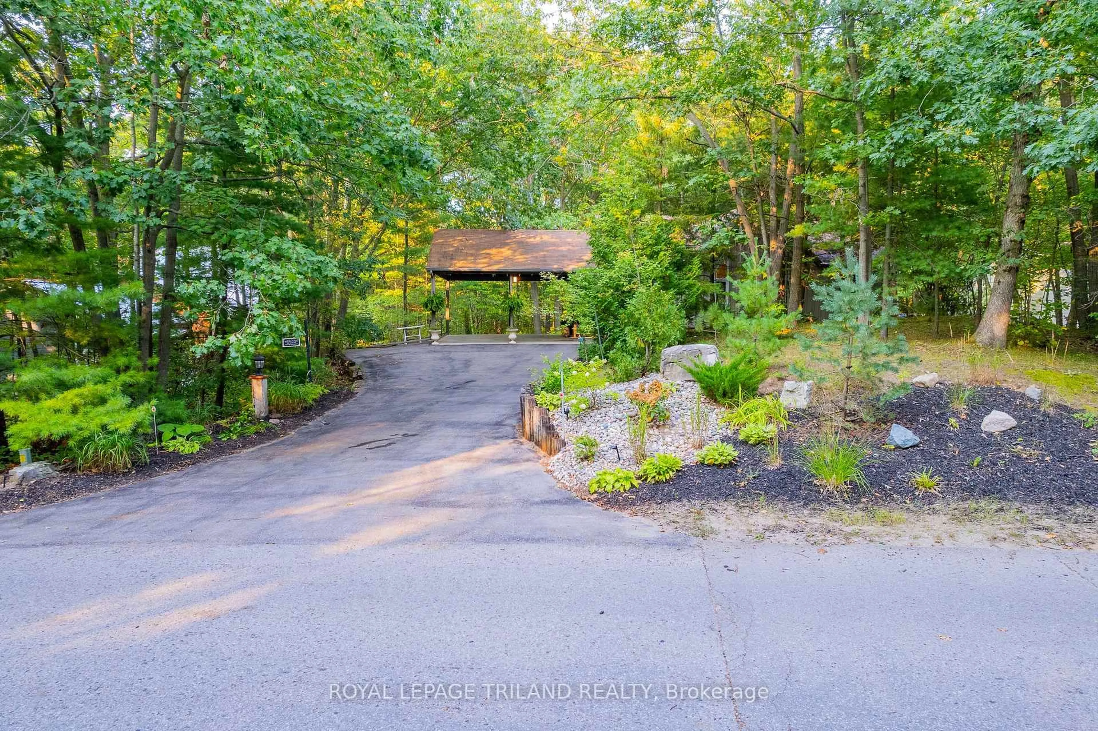 A pic from outside/outdoor area/front of a property/back of a property/a pic from drone, forest/trees view for 10248 Pinetree Dr, Lambton Shores Ontario N0M 1T0