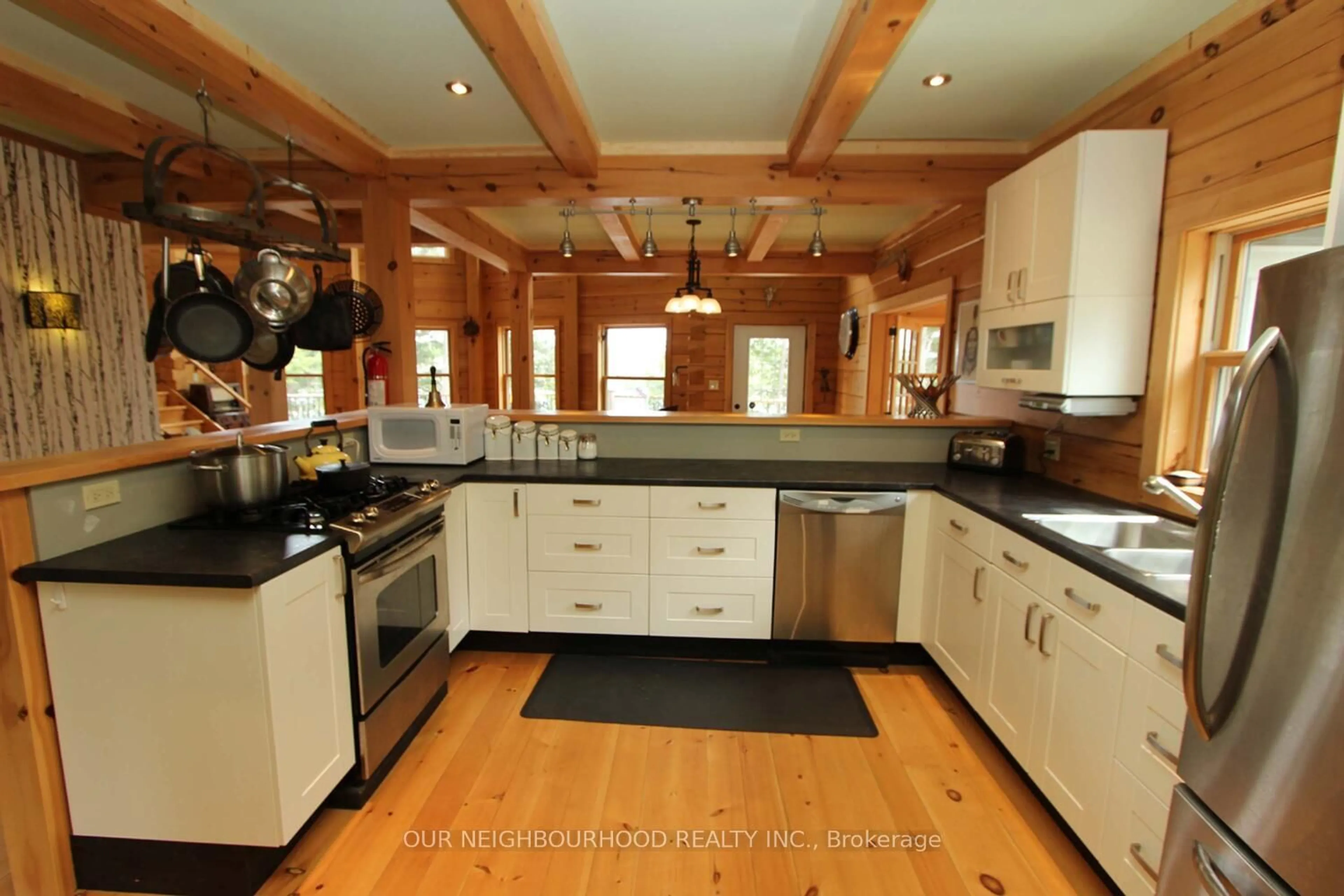 Open concept kitchen, wood/laminate floor for 277 Lake Tangamong, Limoges Ontario K0K 2M0