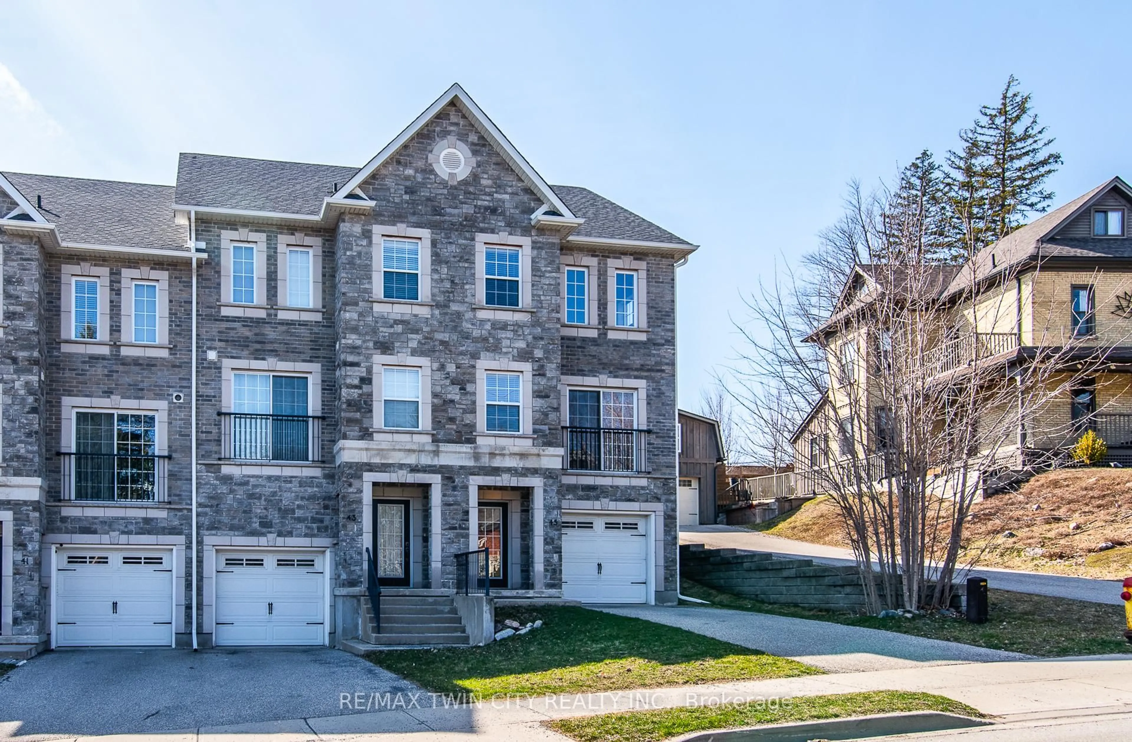 Home with brick exterior material, street for 45 Woolwich St, Kitchener Ontario N2K 1S2