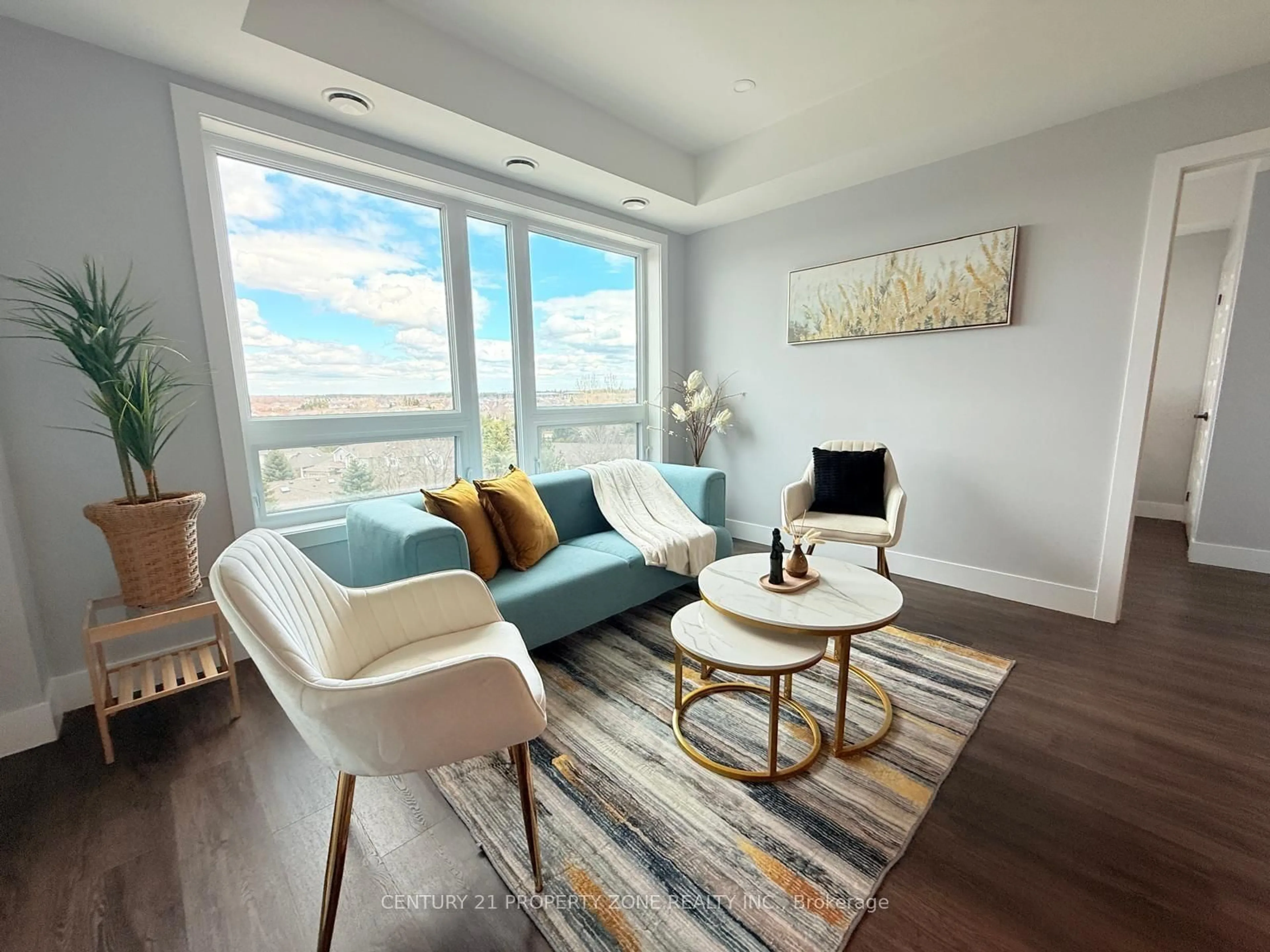 Living room with furniture, wood/laminate floor for 26 Lowes Rd #604, Guelph Ontario N1L 1E1