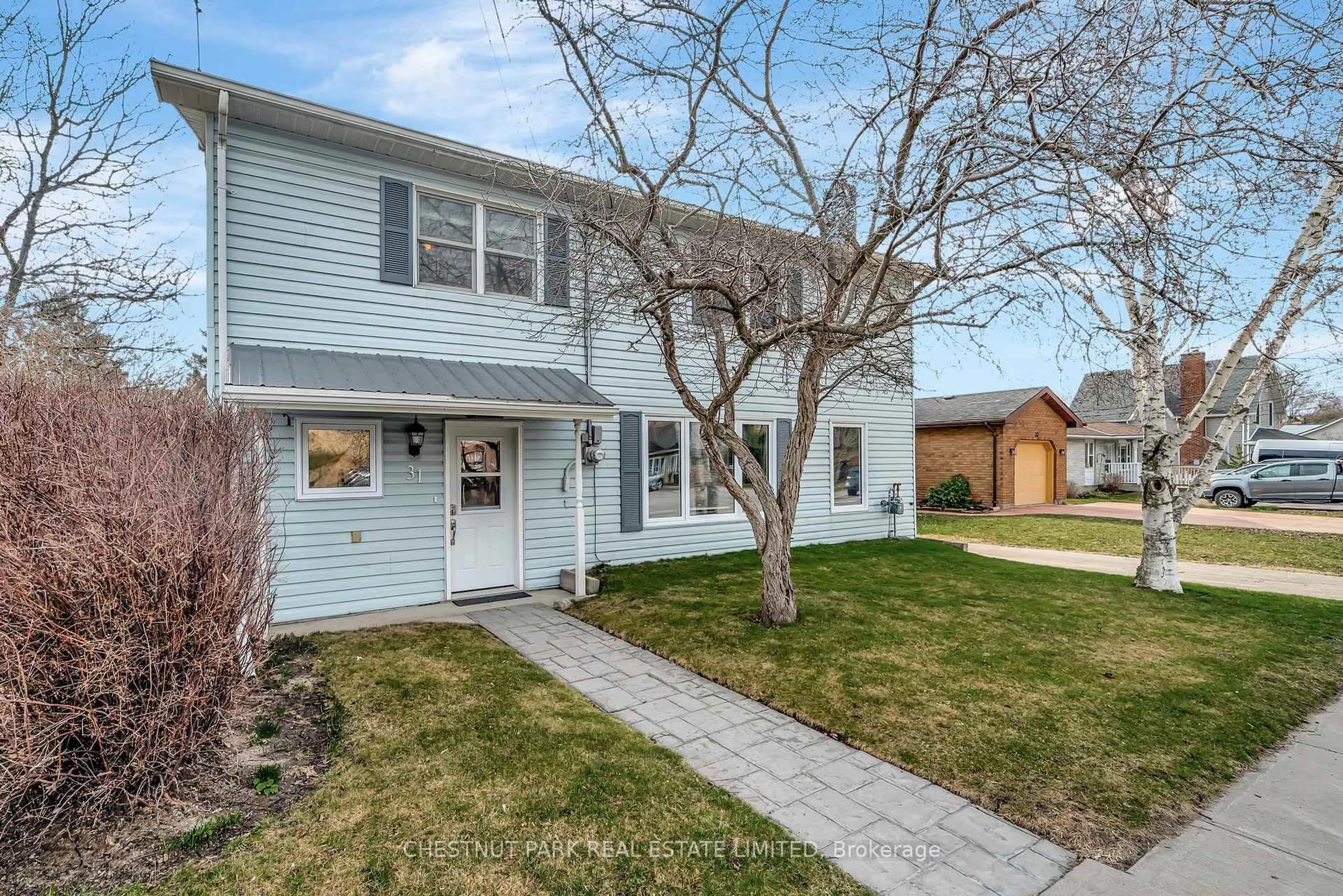 Home with vinyl exterior material, street for 31 Lake St, Prince Edward County Ontario K0K 2T0