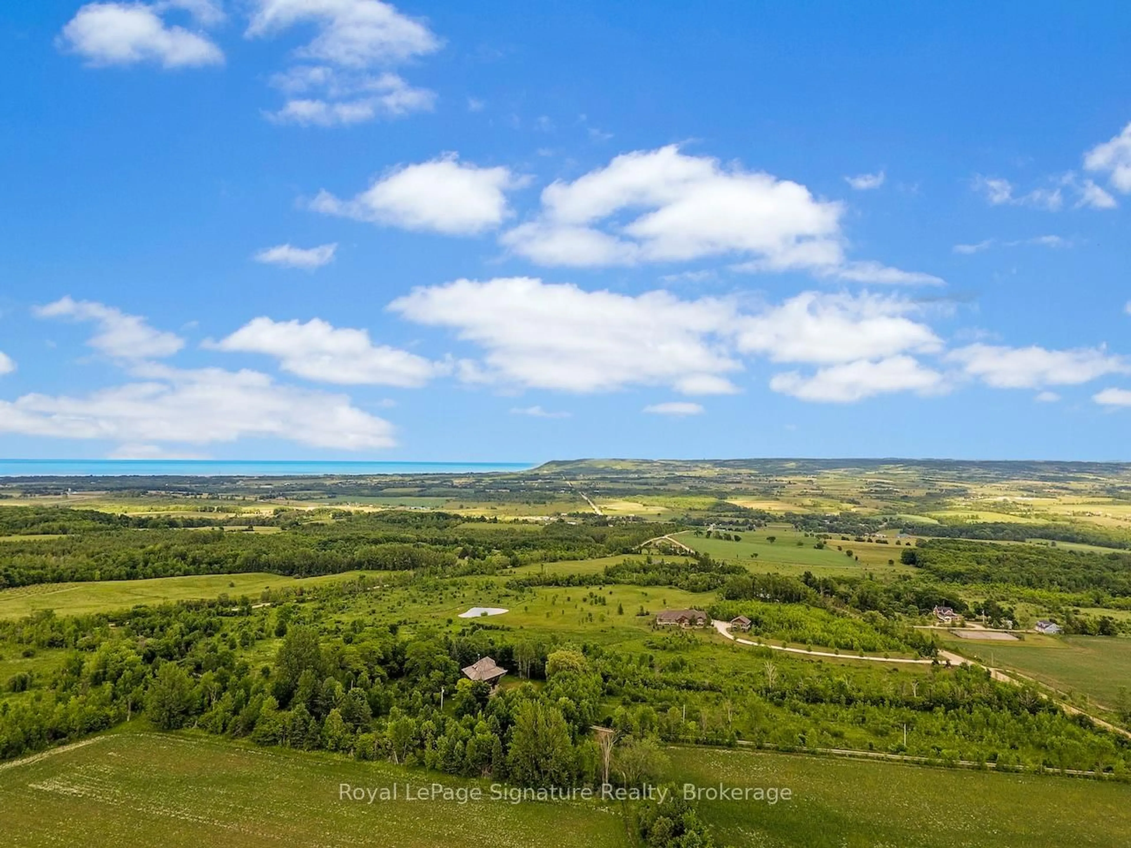 A pic from outside/outdoor area/front of a property/back of a property/a pic from drone, water/lake/river/ocean view for 807035 25th Side Rd, Grey Highlands Ontario N0C 1G0