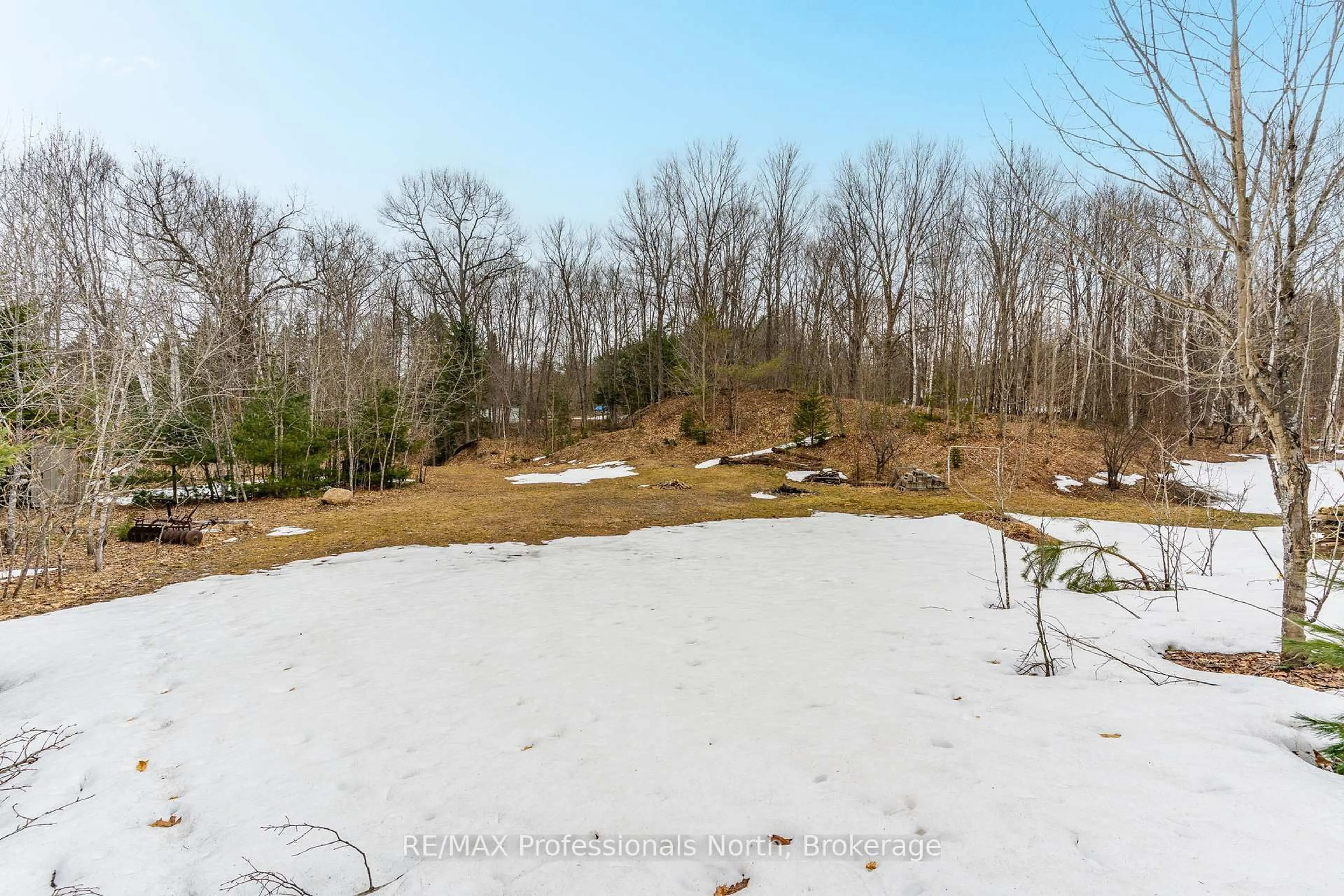 A pic from outside/outdoor area/front of a property/back of a property/a pic from drone, forest/trees view for 1010 Sturgeon Dr, Minden Hills Ontario K0M 2K0