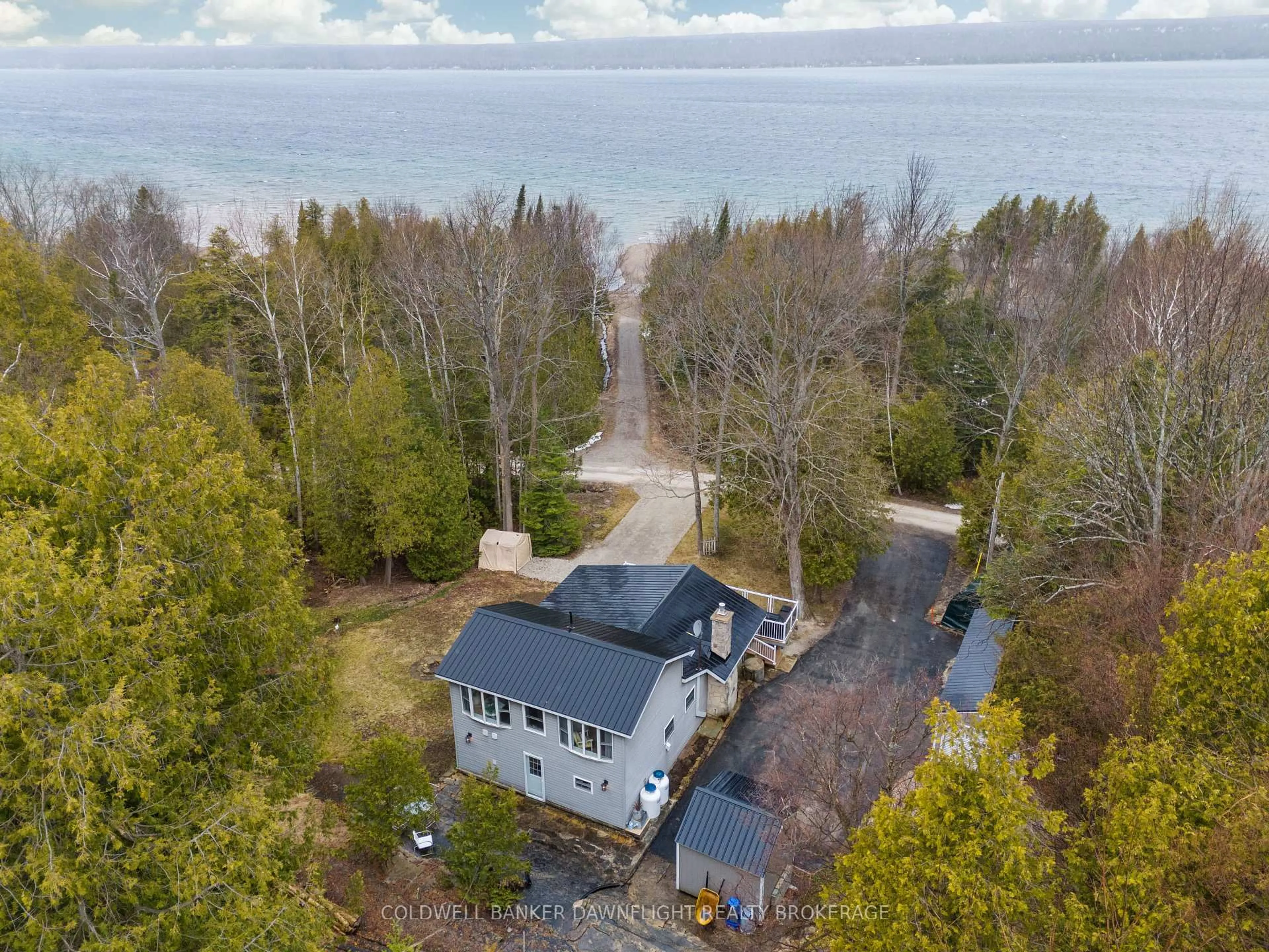 A pic from outside/outdoor area/front of a property/back of a property/a pic from drone, water/lake/river/ocean view for 110 Mallard St, Georgian Bluffs Ontario N0H 2T0