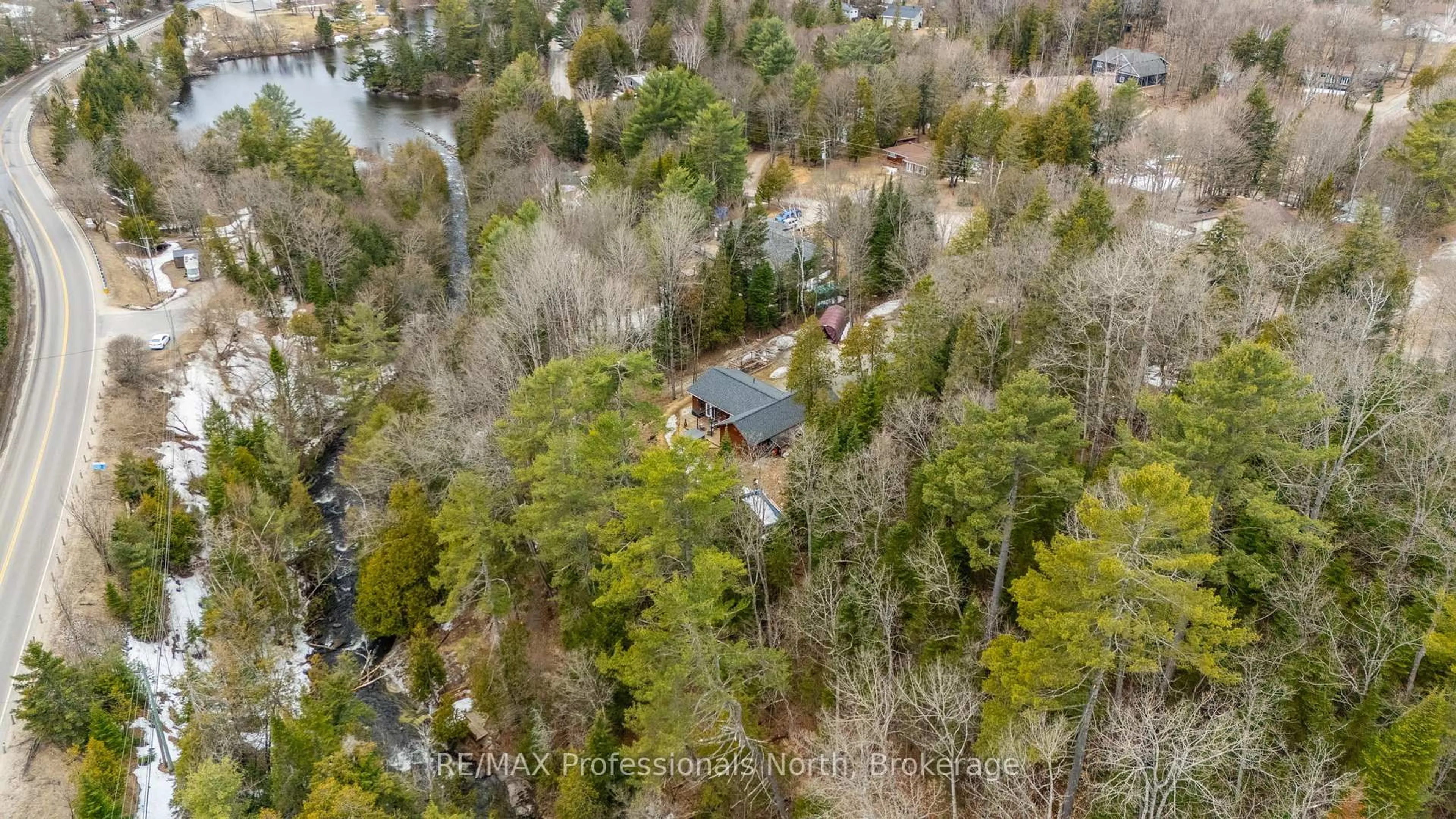 A pic from outside/outdoor area/front of a property/back of a property/a pic from drone, water/lake/river/ocean view for 104 Riverside Dr, Dysart et al Ontario K0M 1S0