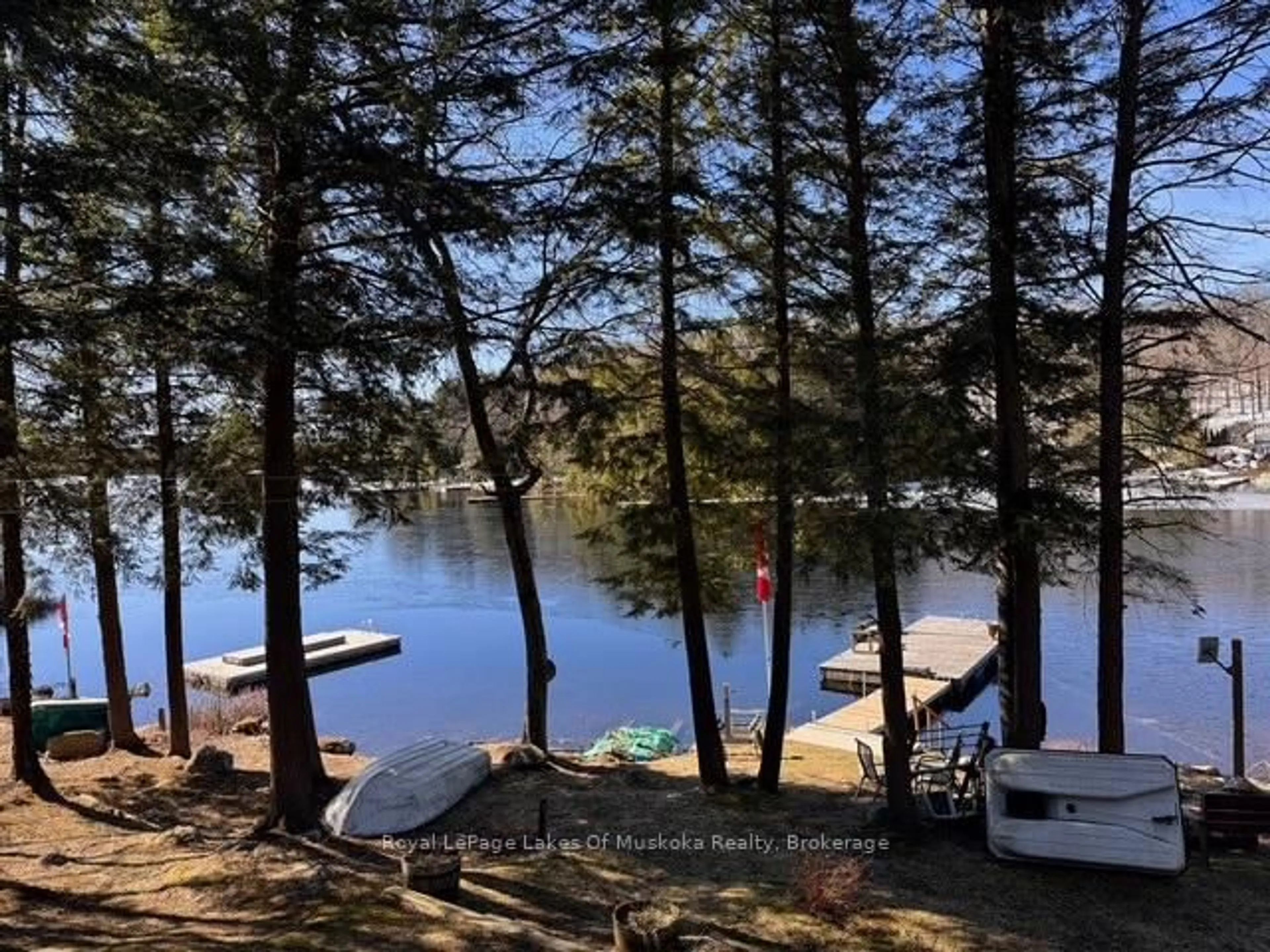 A pic from outside/outdoor area/front of a property/back of a property/a pic from drone, water/lake/river/ocean view for 1019 Lakeshore Rd, Bracebridge Ontario P1L 1X3
