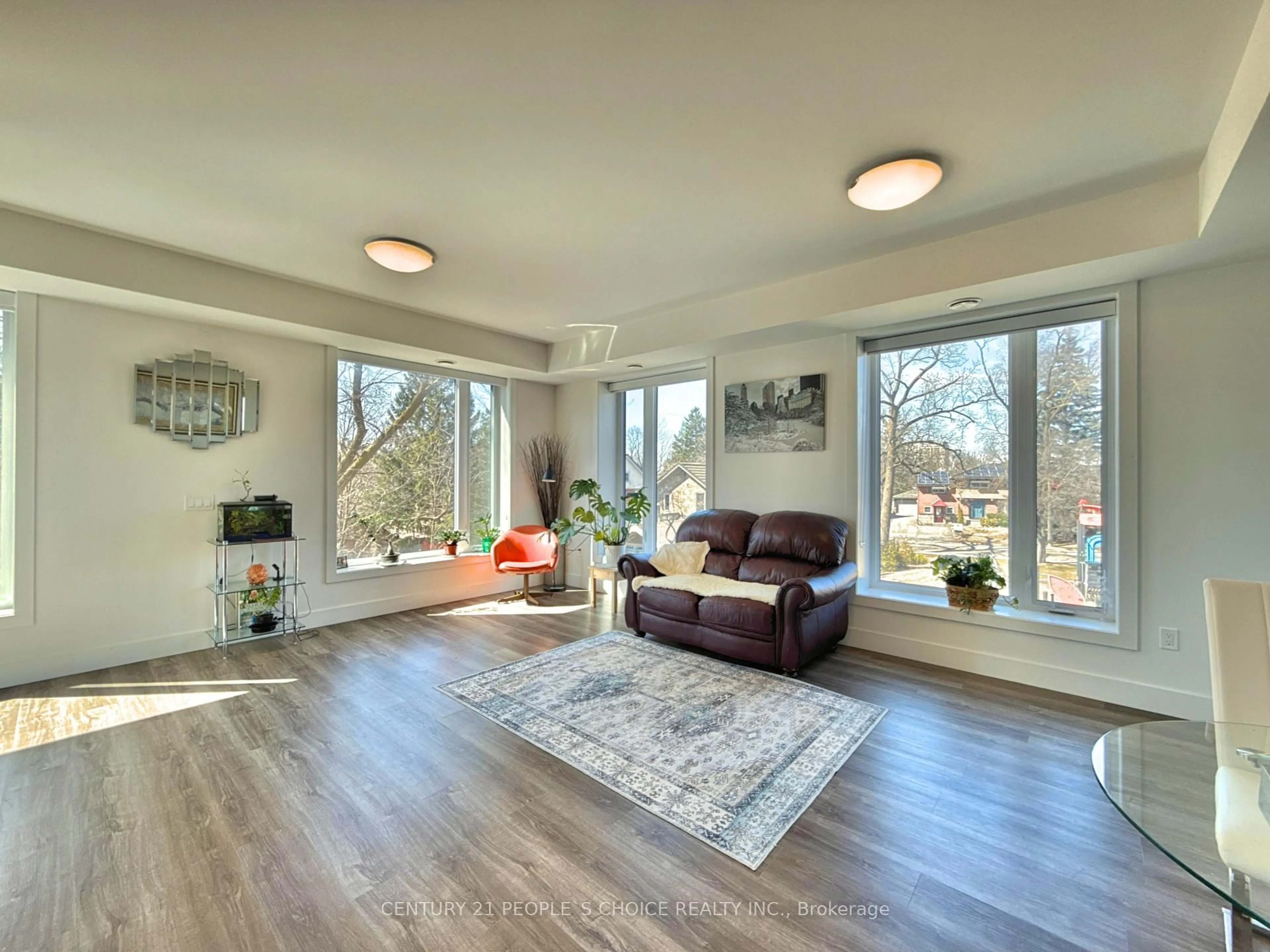 Living room with furniture, wood/laminate floor for 103 Roger St #202, Waterloo Ontario N2J 0G2