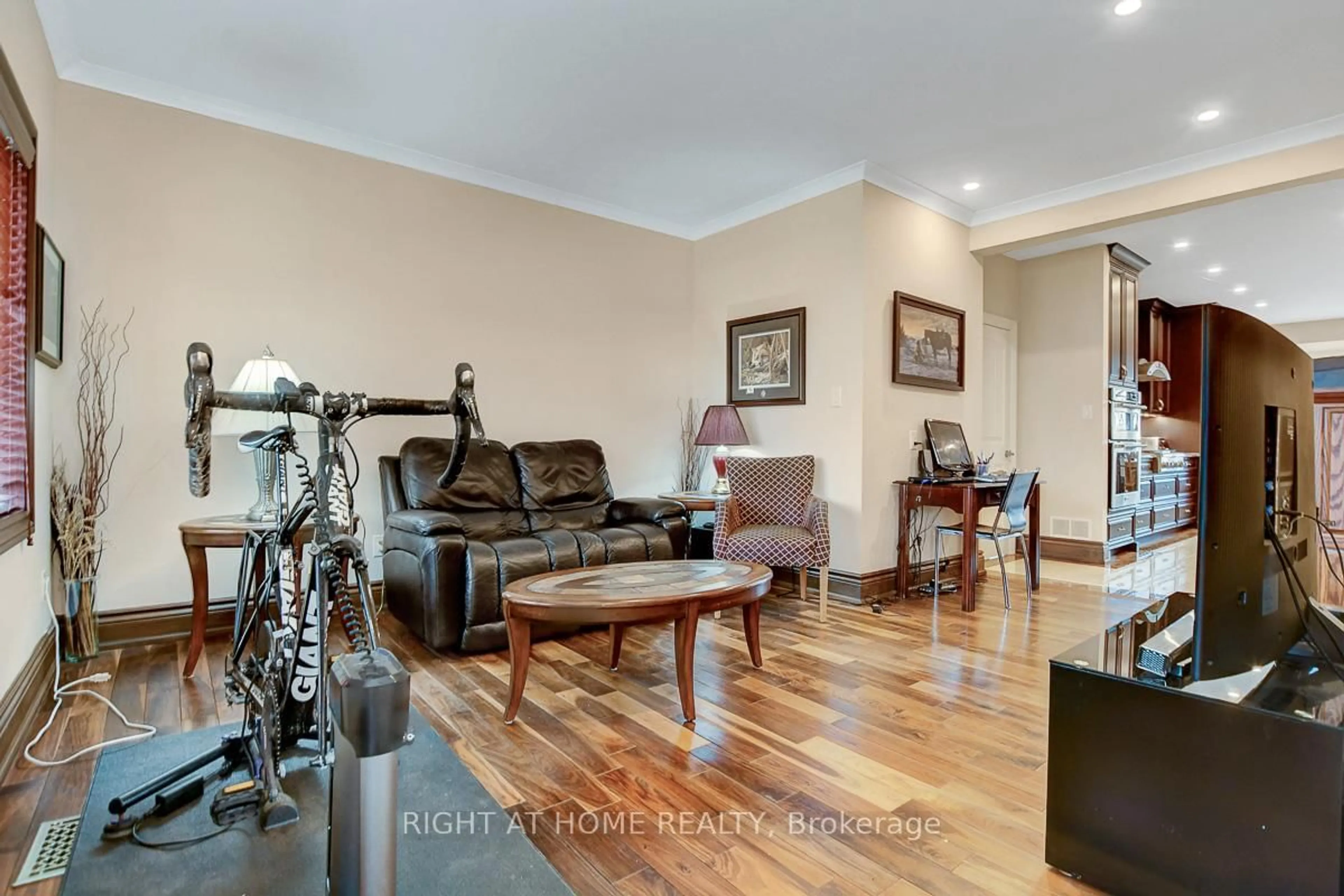 Living room with furniture, wood/laminate floor for 1271 Field St, Ottawa Ontario K2C 2P9