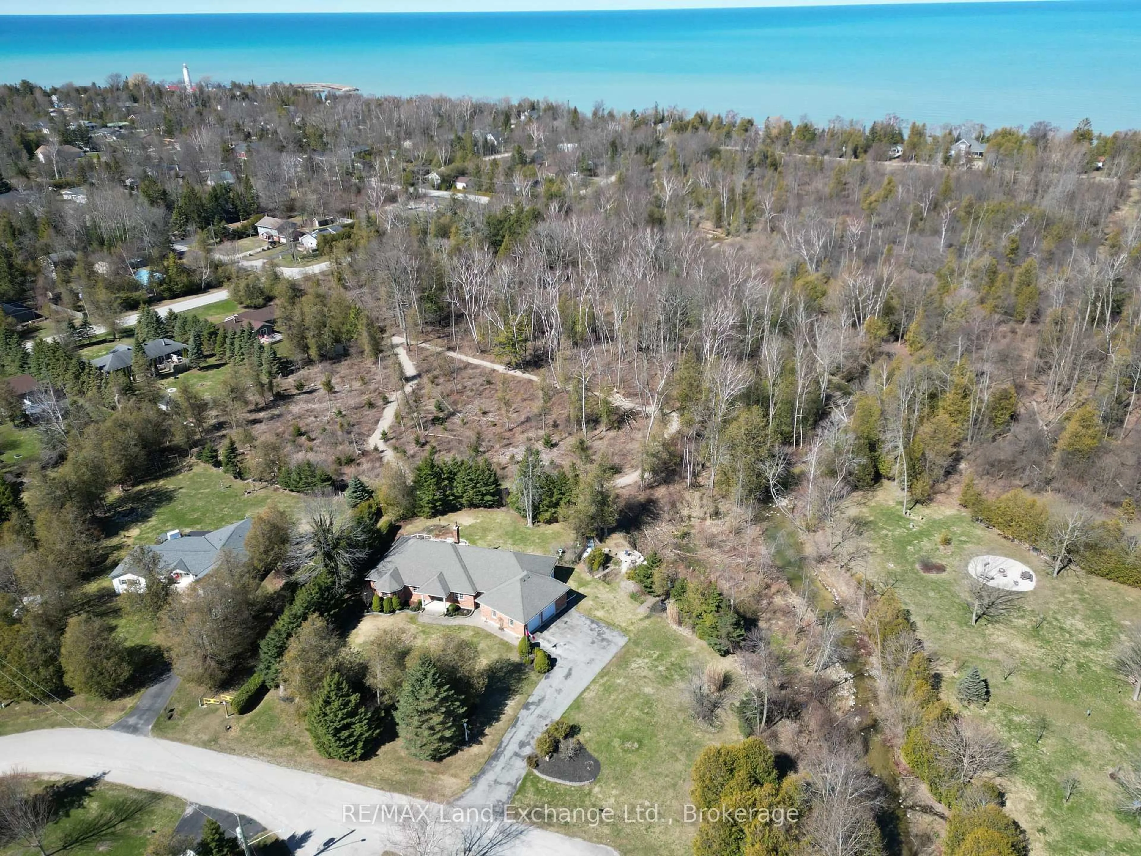 A pic from outside/outdoor area/front of a property/back of a property/a pic from drone, water/lake/river/ocean view for 115 Deerhurst Dr, Huron-Kinloss Ontario N2Z 2X3