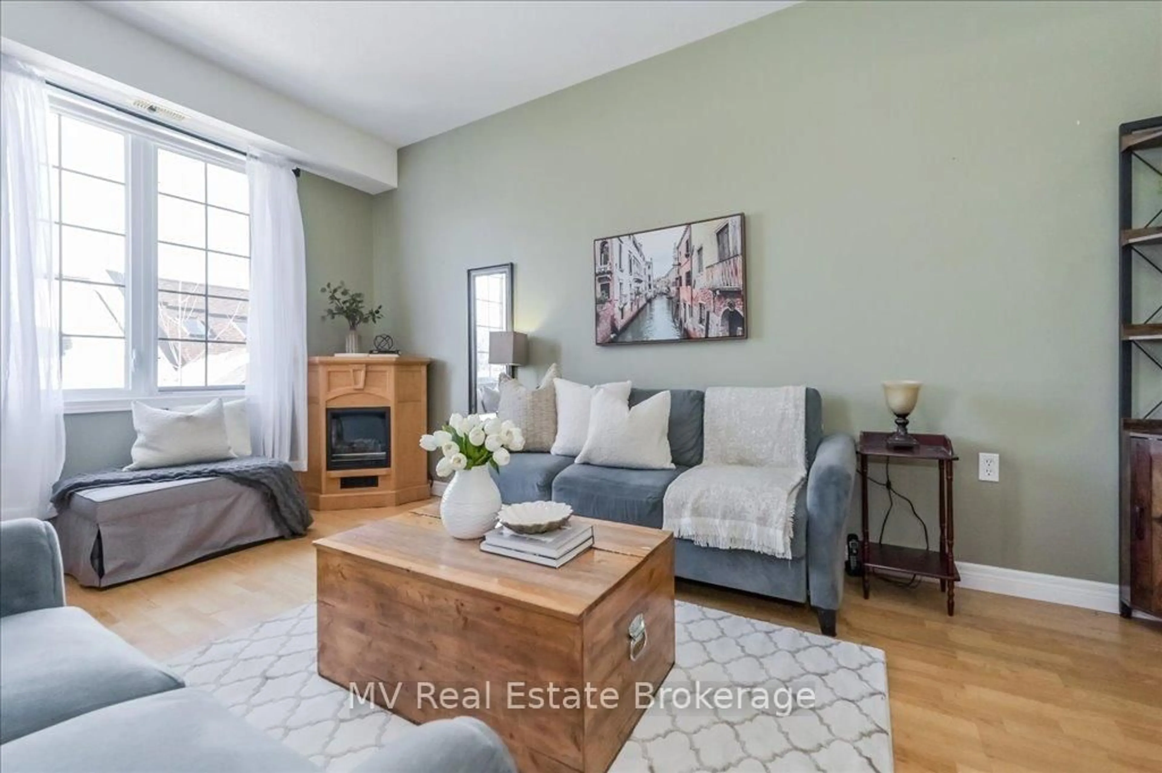 Living room with furniture, wood/laminate floor for 20 Station Sq #209, Centre Wellington Ontario N0B 1S0