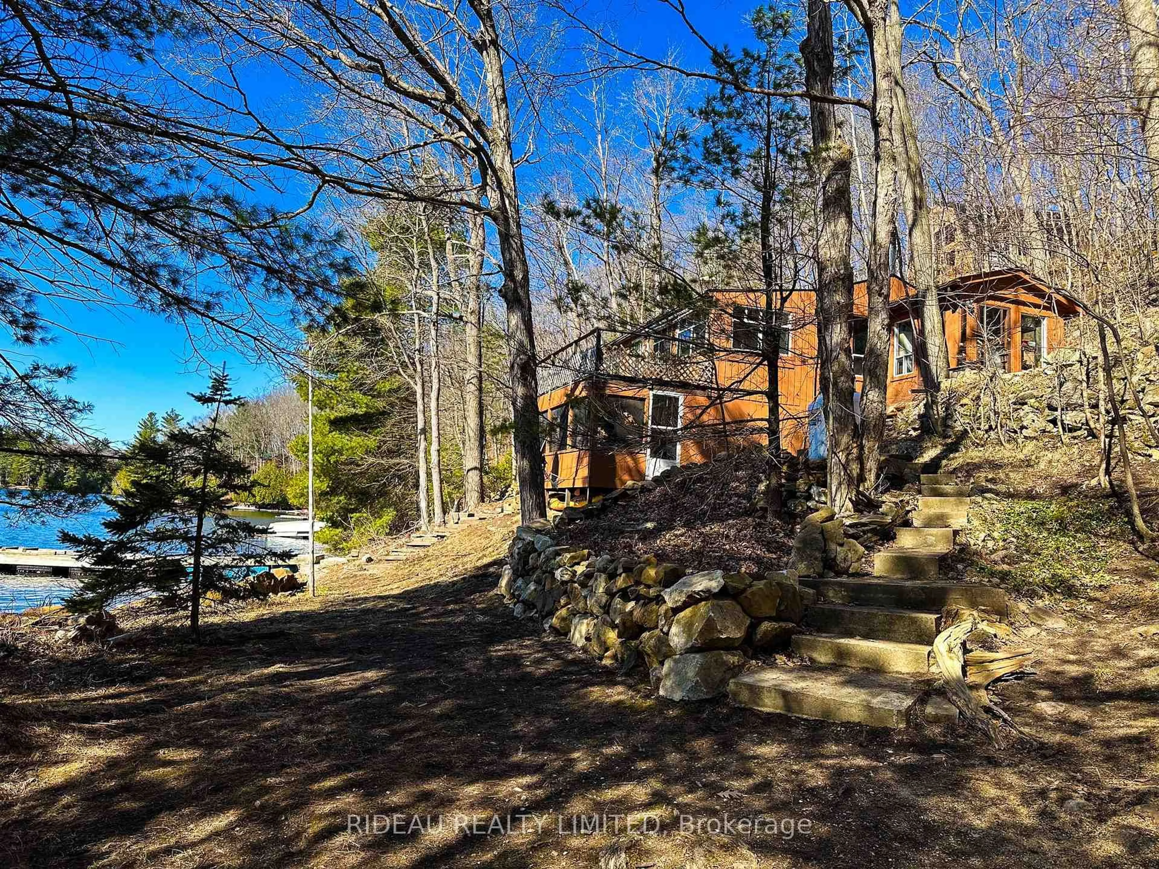 A pic from outside/outdoor area/front of a property/back of a property/a pic from drone, forest/trees view for 72 Dragonfly Lane, Westport Ontario K0G 1X0