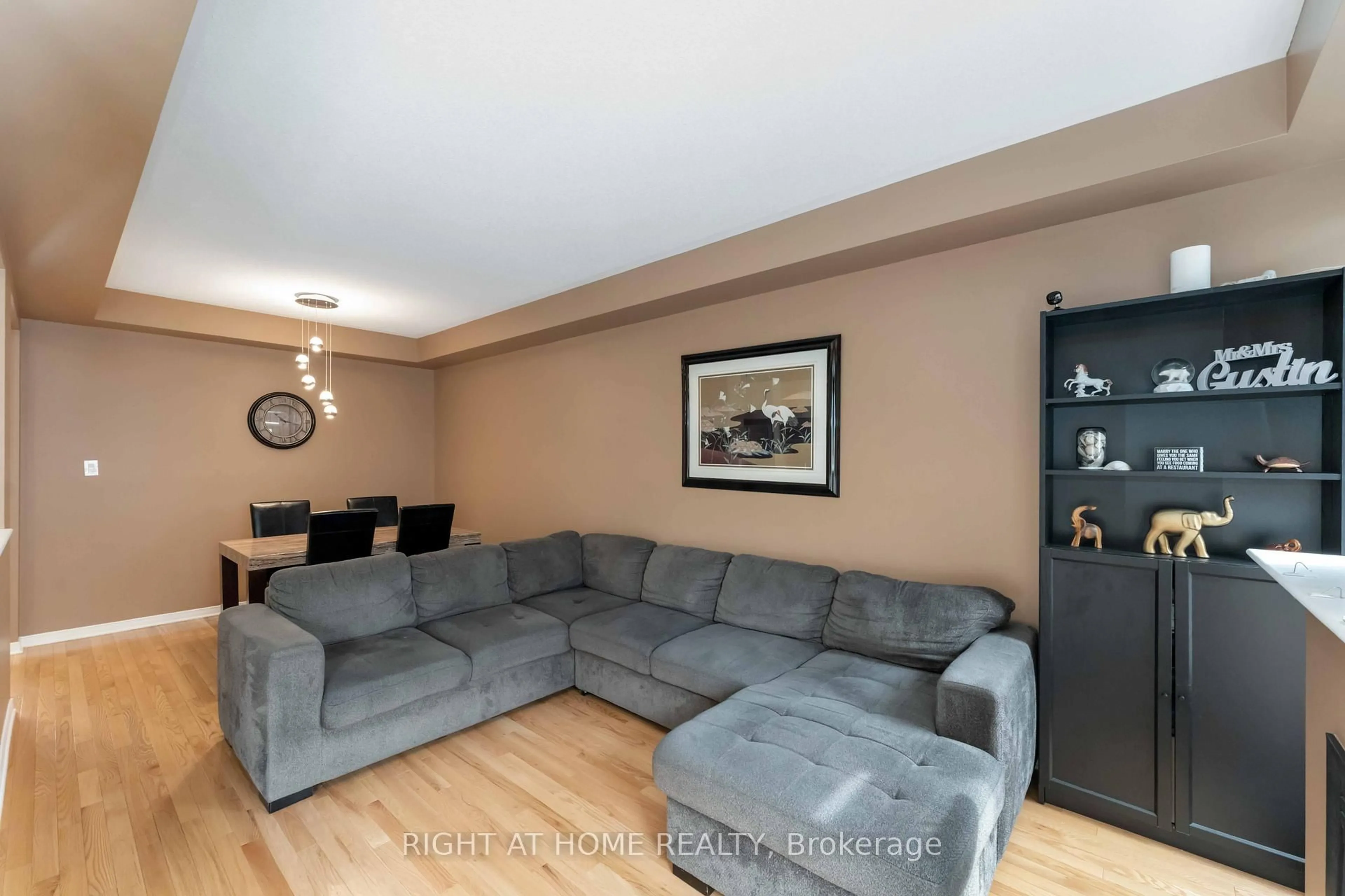 Living room with furniture, wood/laminate floor for 753 Oakglade Ave, Ottawa Ontario K2M 0B5