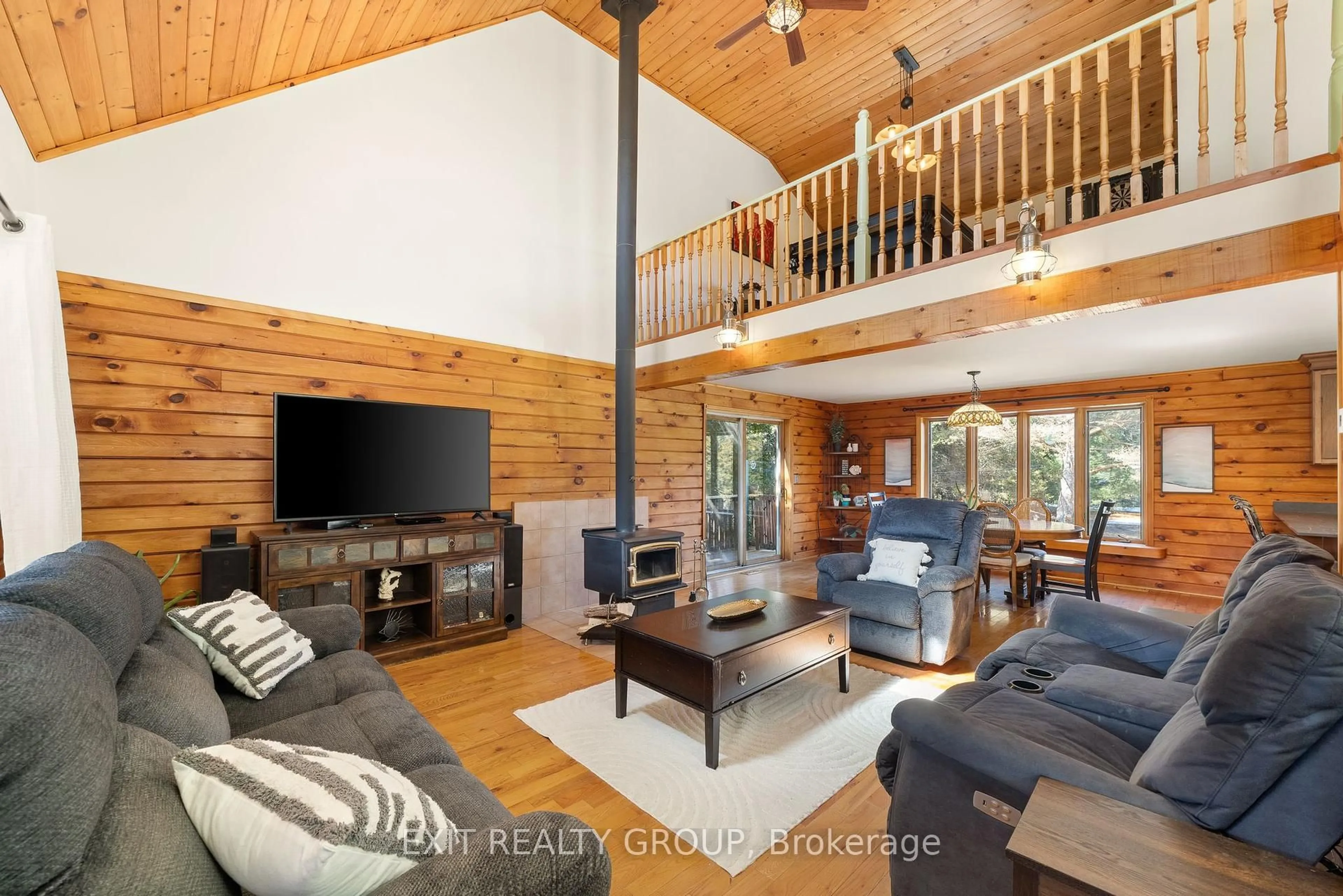 Living room with furniture, wood/laminate floor for 927 Scuttlehole Rd, Belleville Ontario K0K 2Y0