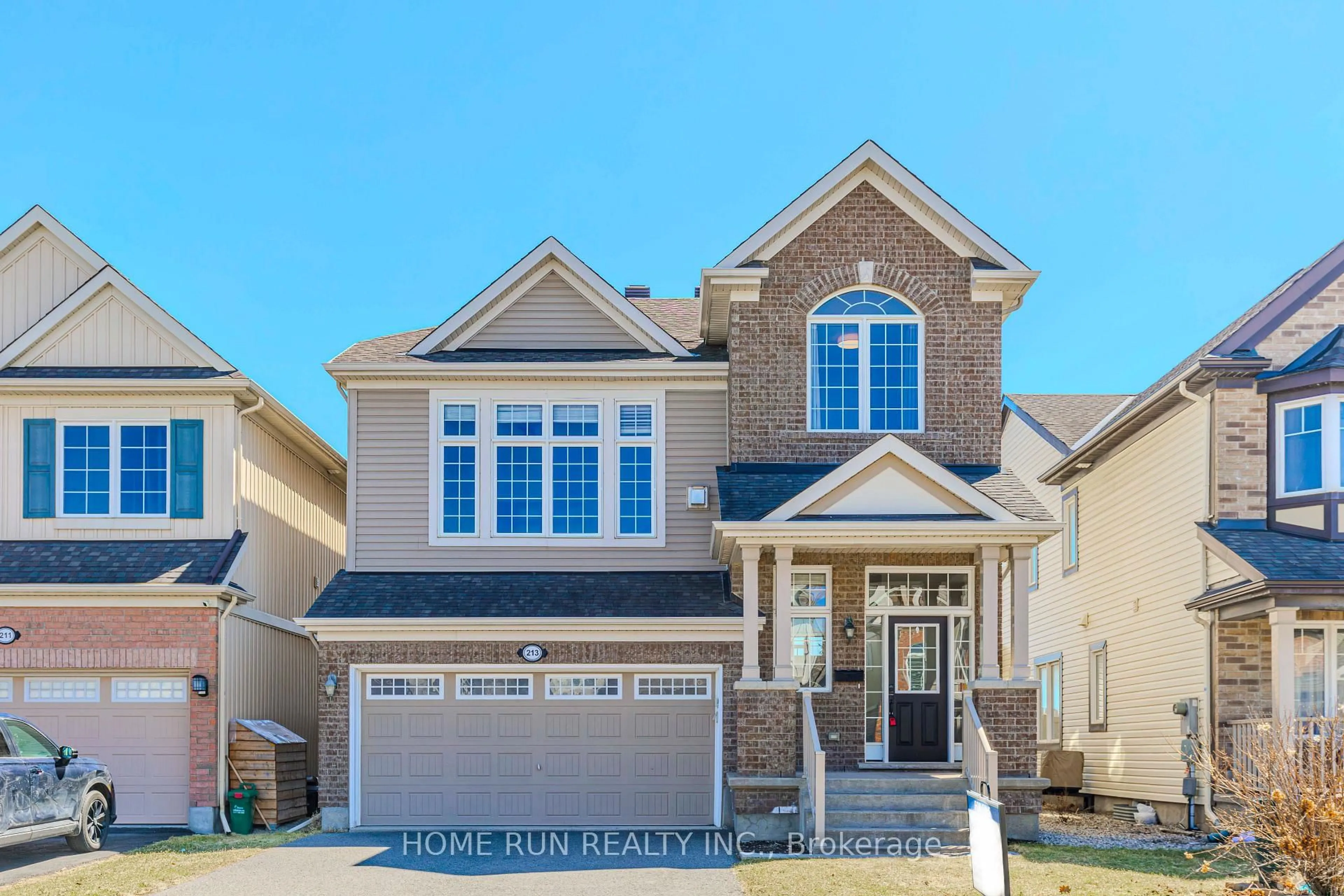 Home with brick exterior material, street for 213 Dutchmans Way, Ottawa Ontario K2J 5W5