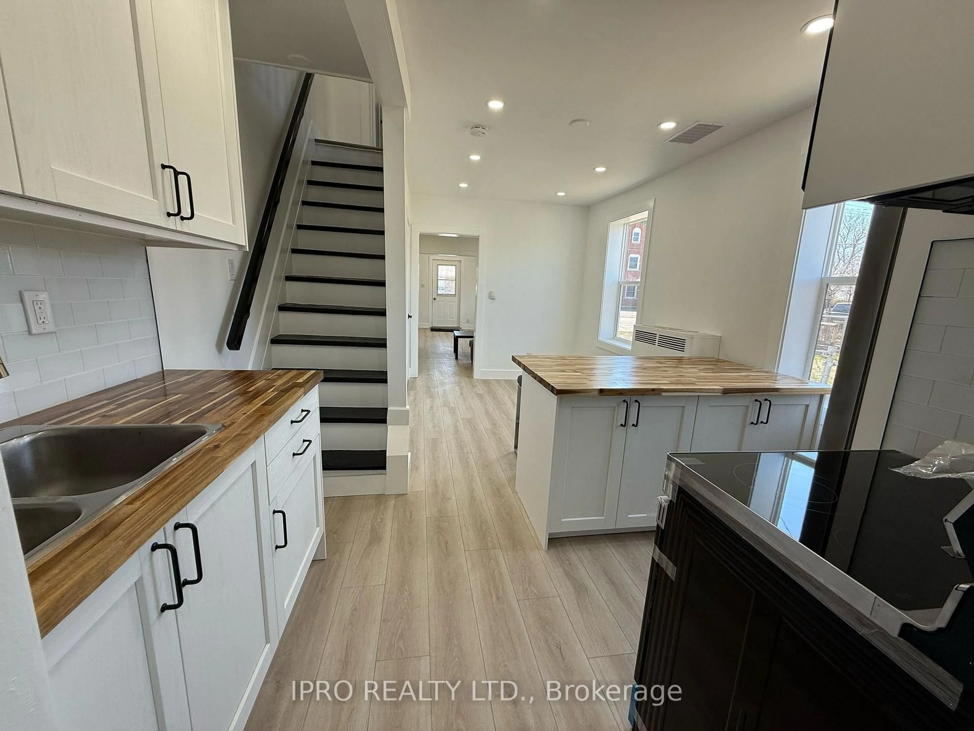 Open concept kitchen, wood/laminate floor for 2042-44 Dundas St, Edwardsburgh/Cardinal Ontario K0E 1E0