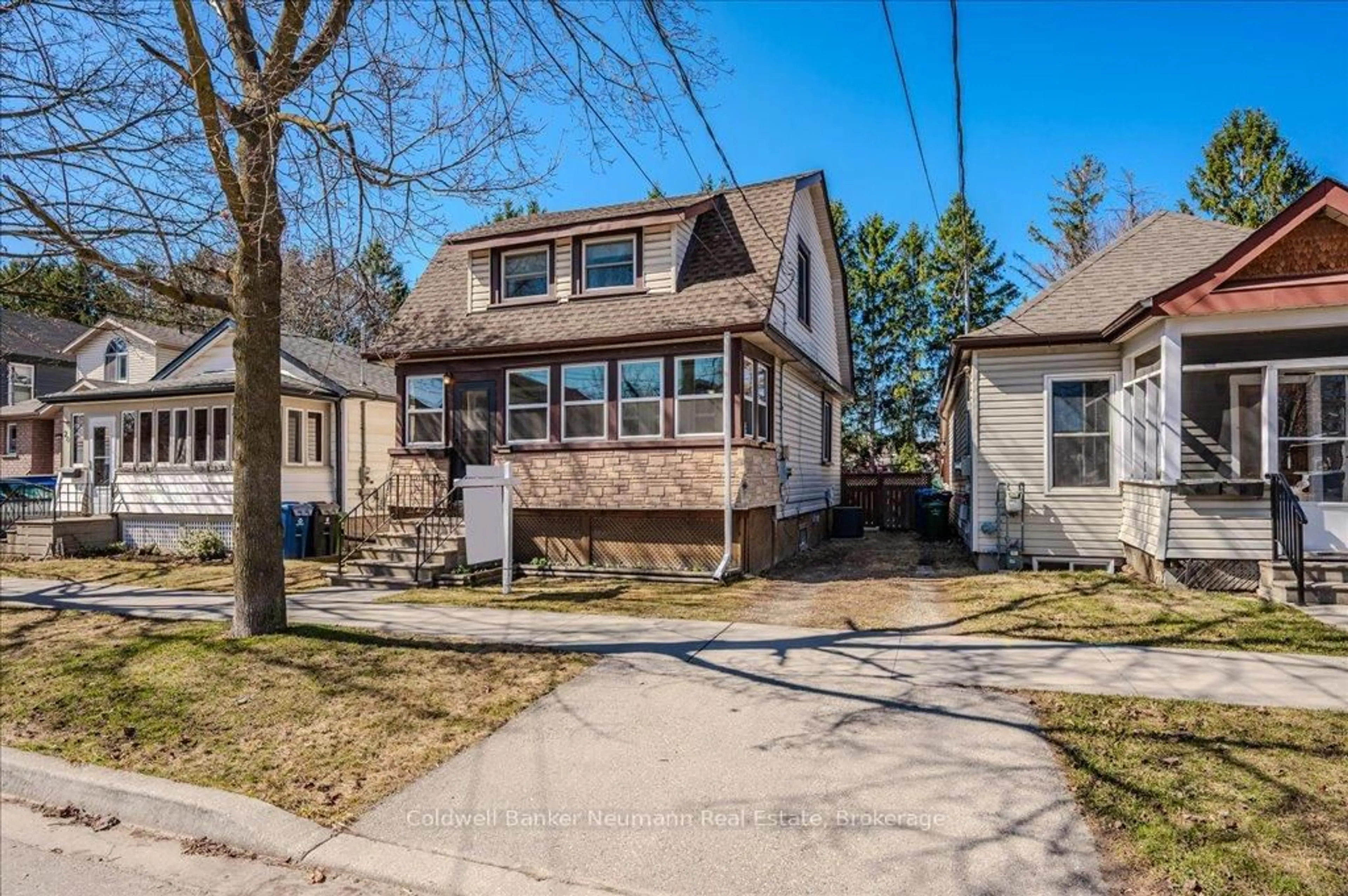 Home with vinyl exterior material, street for 22 Simcoe St, Guelph Ontario N1E 3B8