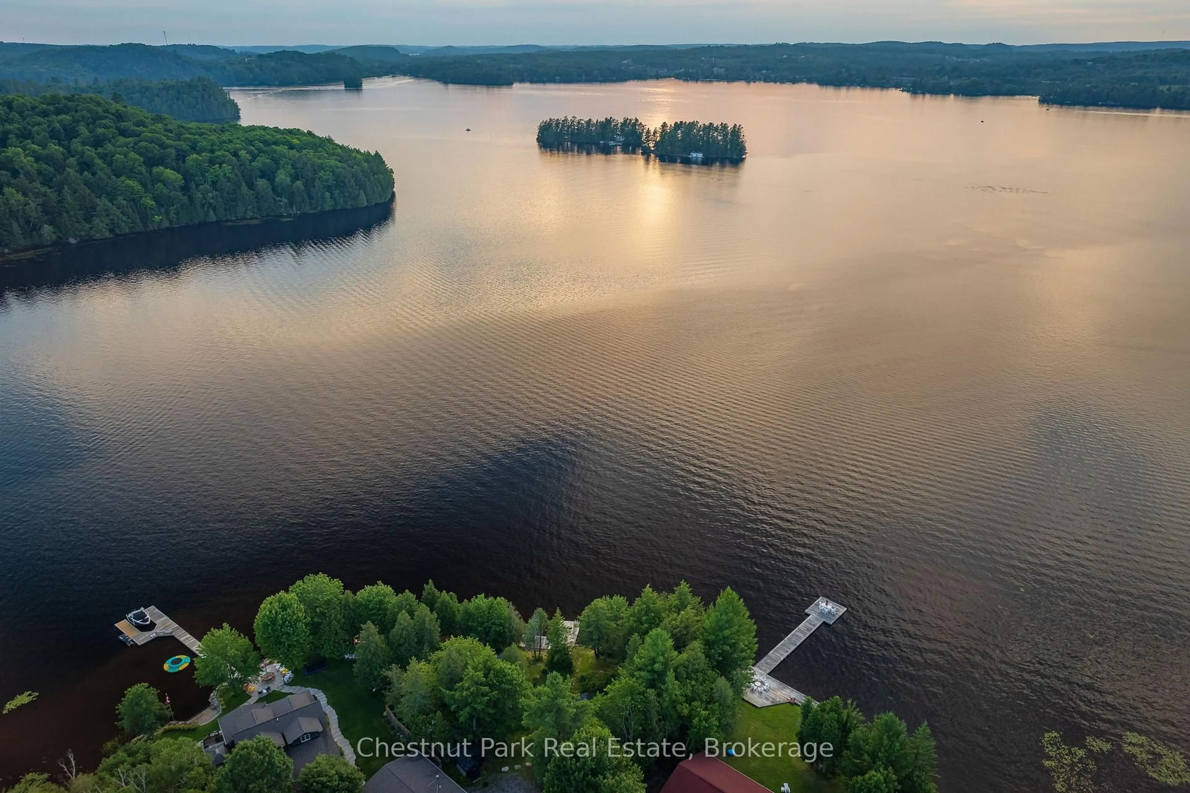 A pic from outside/outdoor area/front of a property/back of a property/a pic from drone, water/lake/river/ocean view for 464 Springfield Rd, Huntsville Ontario P1H 2J3