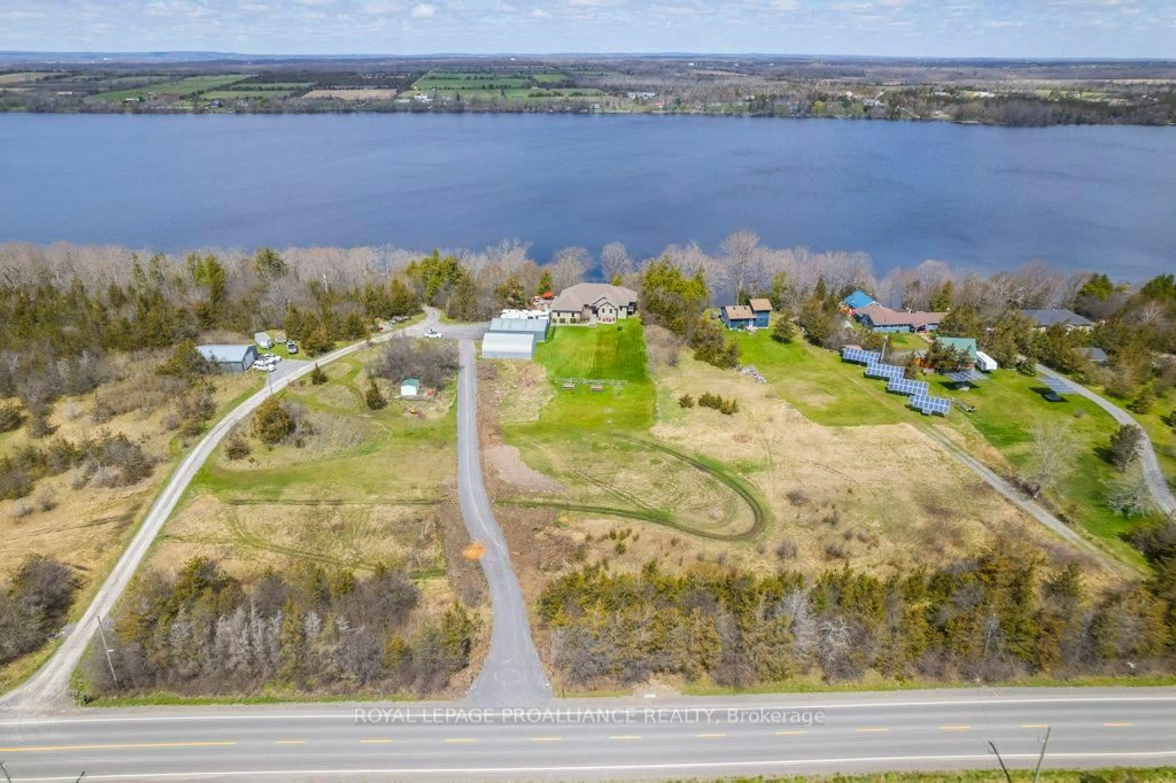 A pic from outside/outdoor area/front of a property/back of a property/a pic from drone, water/lake/river/ocean view for 4992 County Road 1, Prince Edward County Ontario K0K 1T0