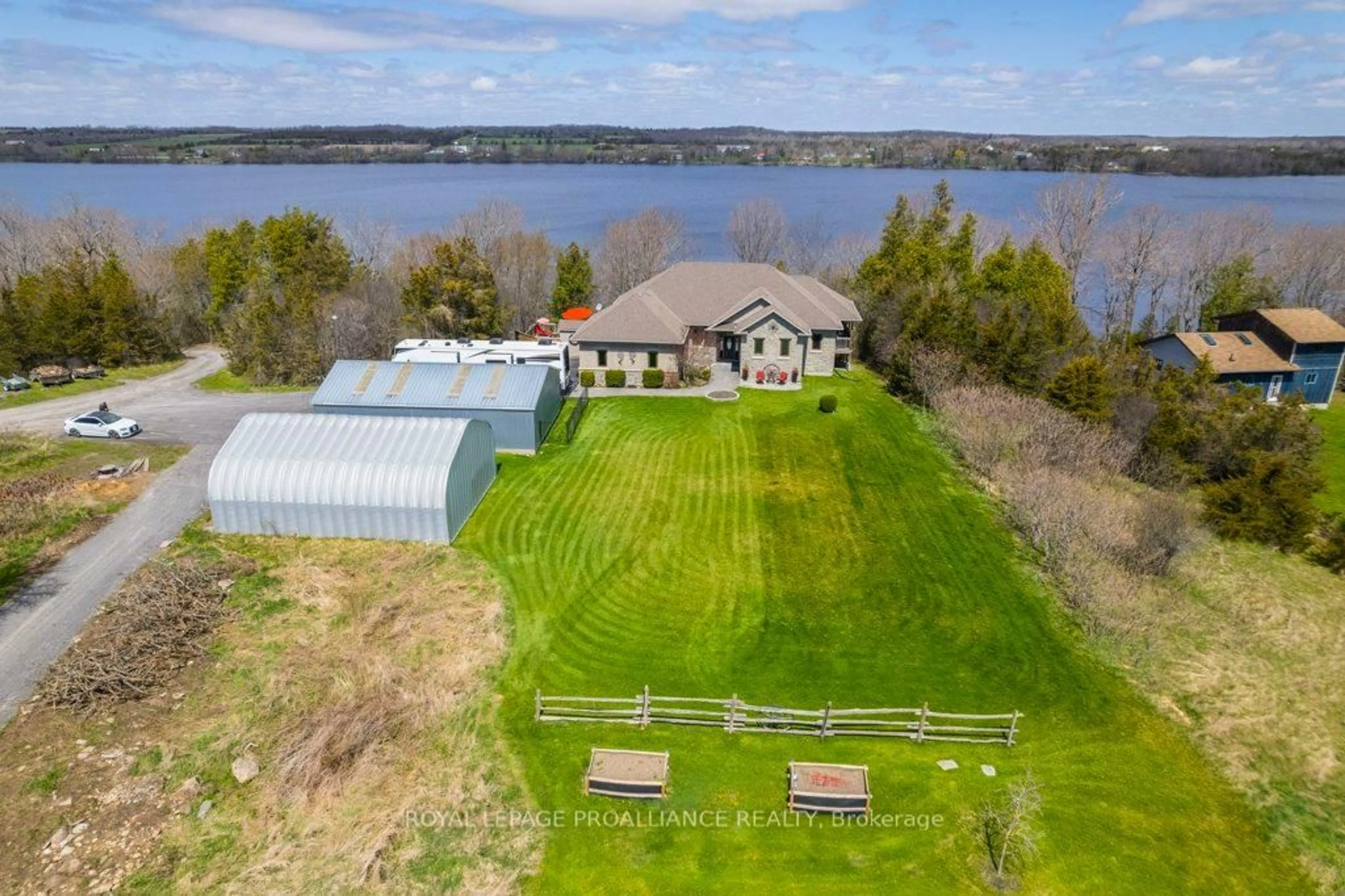 A pic from outside/outdoor area/front of a property/back of a property/a pic from drone, water/lake/river/ocean view for 4992 County Road 1 N/A, Prince Edward County Ontario K0K 1T0