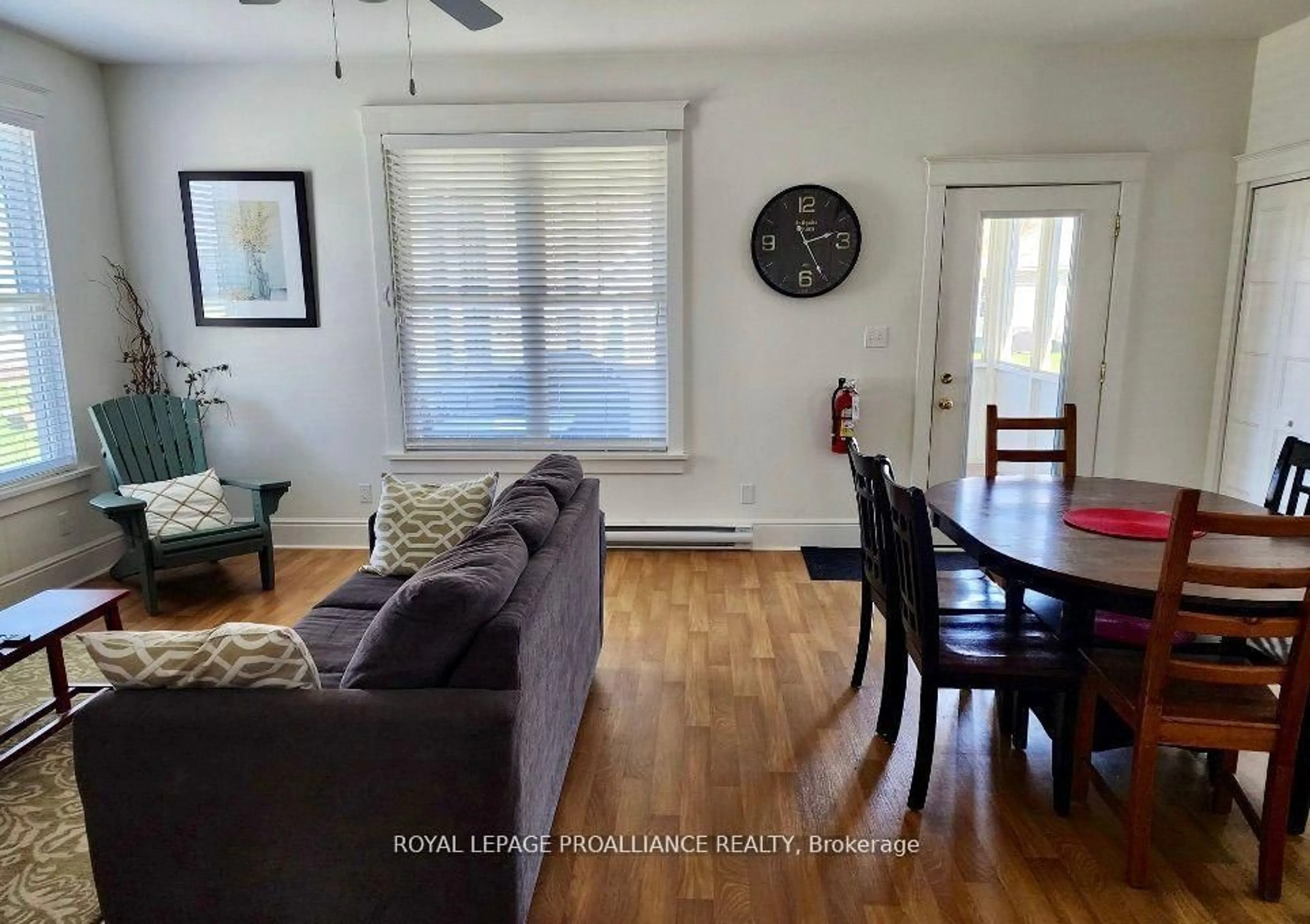 Living room with furniture, wood/laminate floor for 38 Meadow View Lane, Prince Edward County Ontario K0K 1P0
