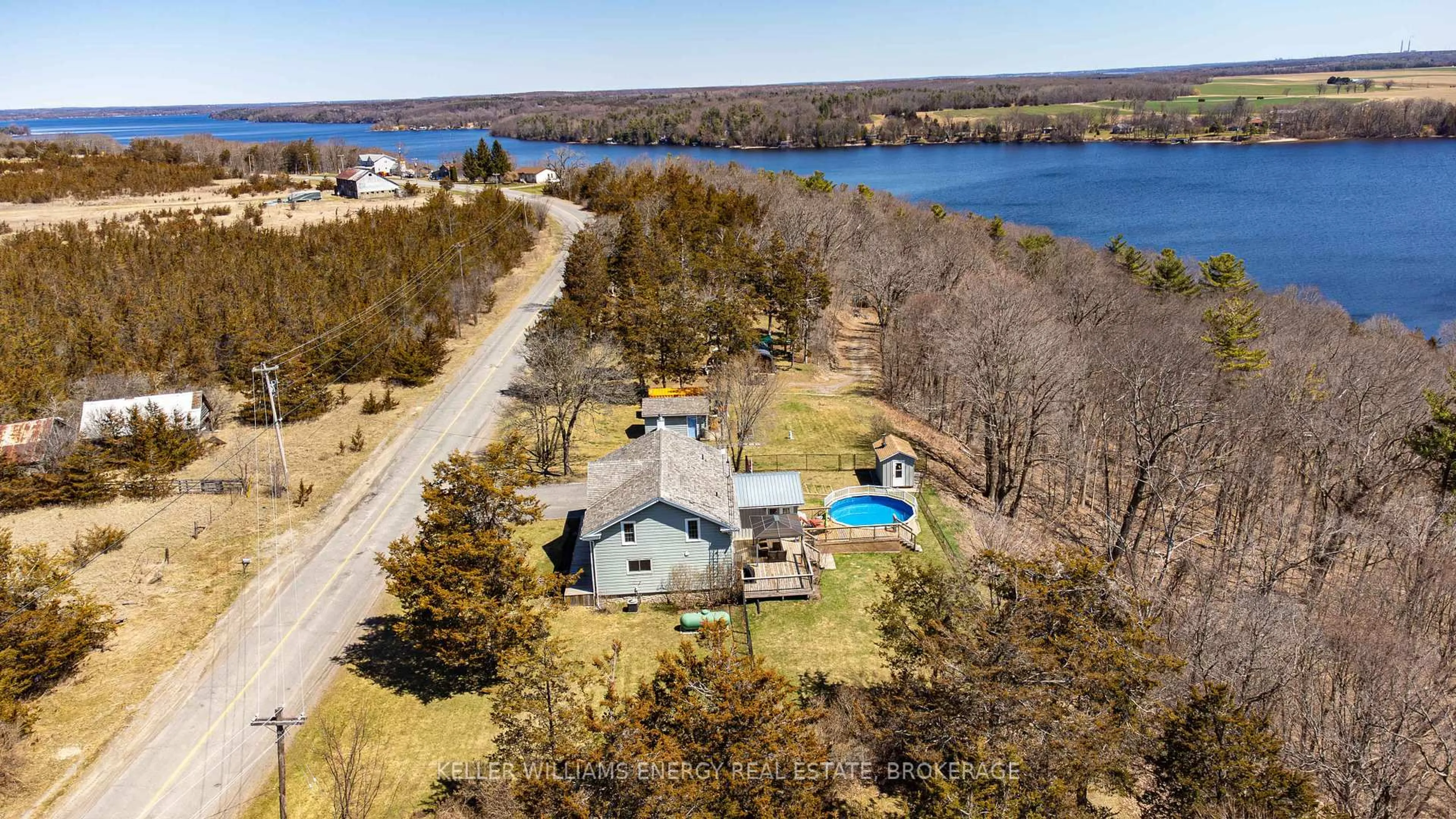 A pic from outside/outdoor area/front of a property/back of a property/a pic from drone, water/lake/river/ocean view for 130 County 35 Rd, Prince Edward County Ontario K0K 2T0
