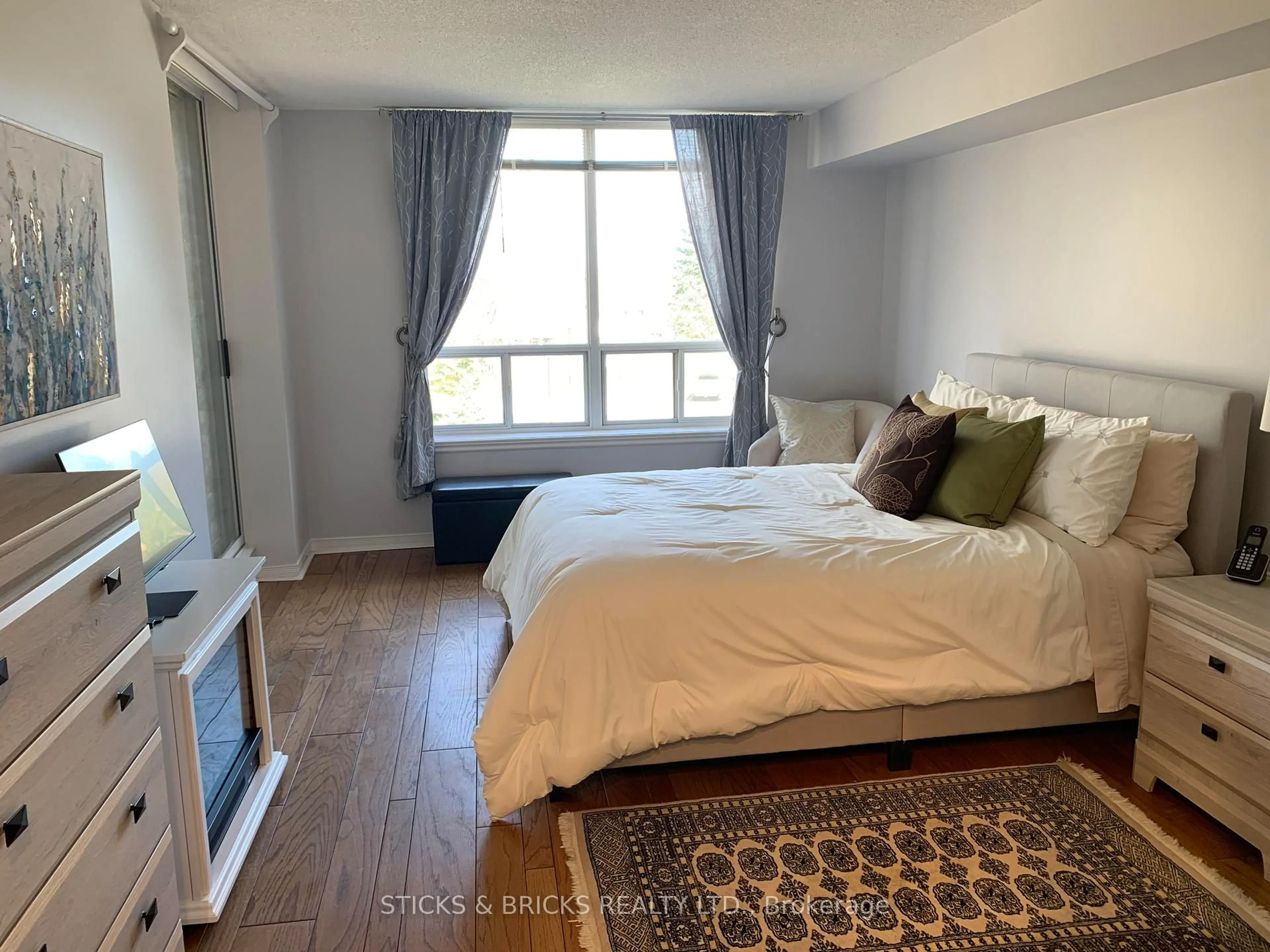 Bedroom with bed, wood/laminate floor for 8111 Forest Glen Dr #301, Niagara Falls Ontario L2H 2Y7