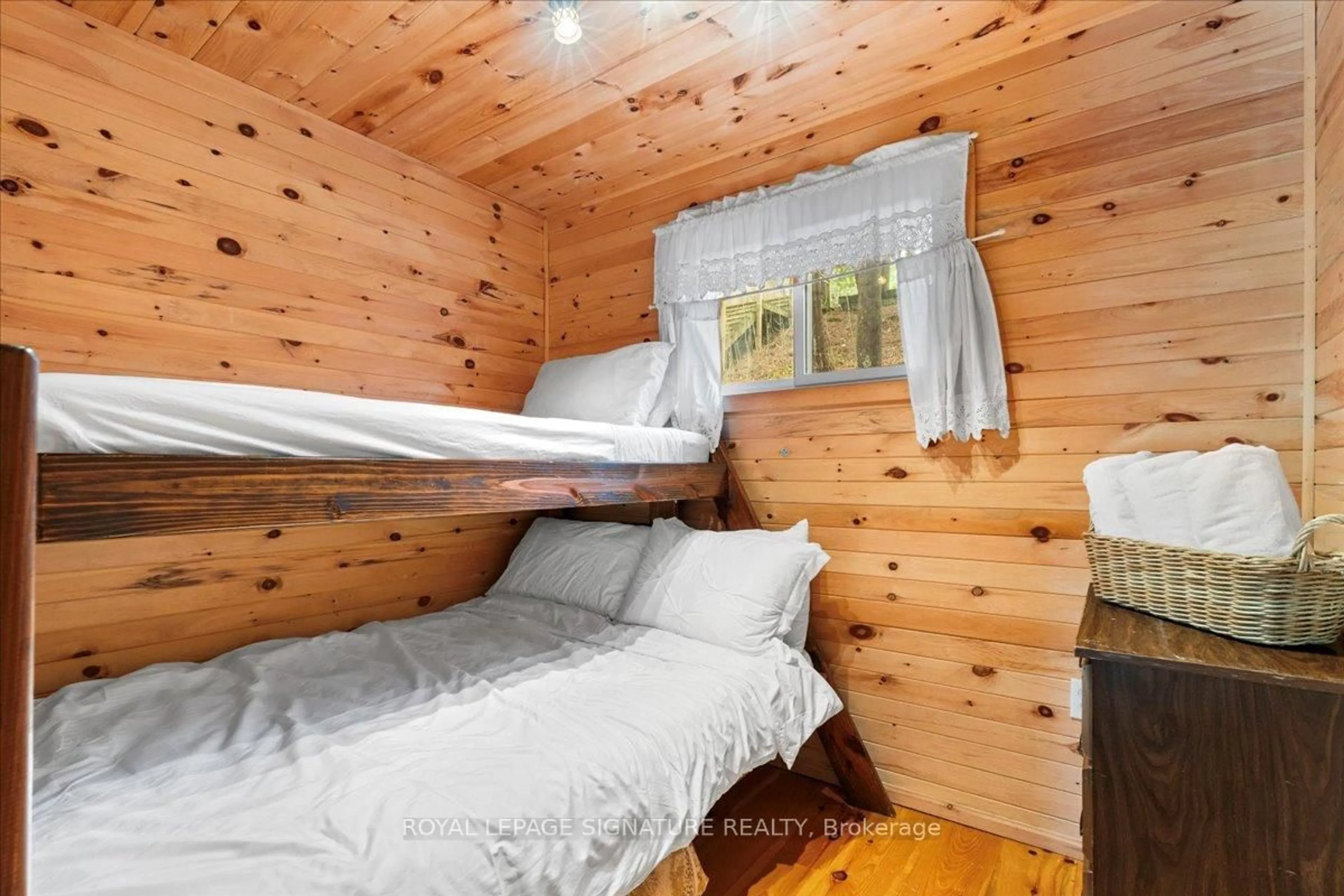 Bedroom with bed, wood/laminate floor for 73 Camp Lane, Tweed Ontario K0K 3J0