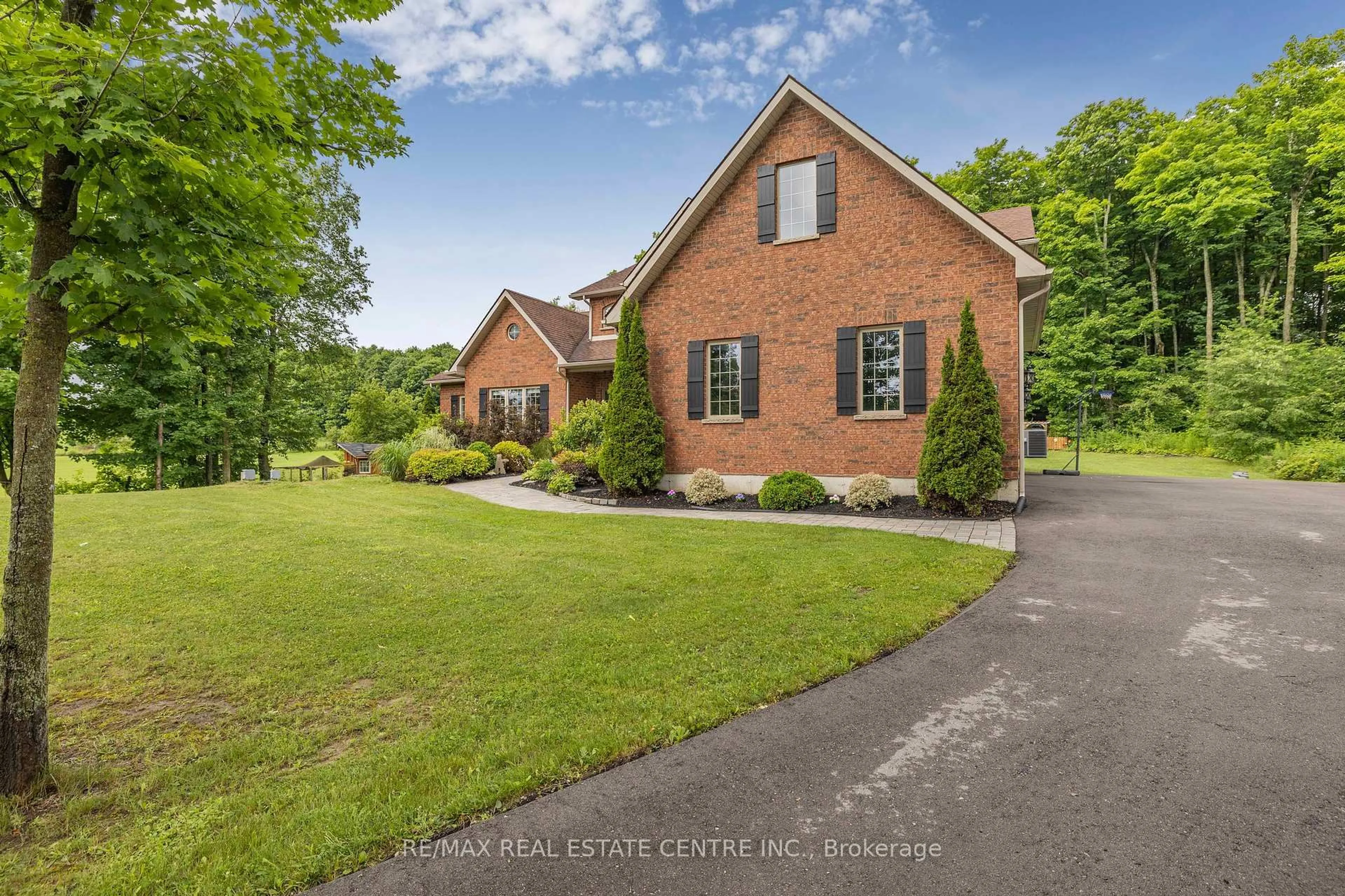 Home with brick exterior material, street for 2 Ashlea Lane, Melancthon Ontario L9V 3M9