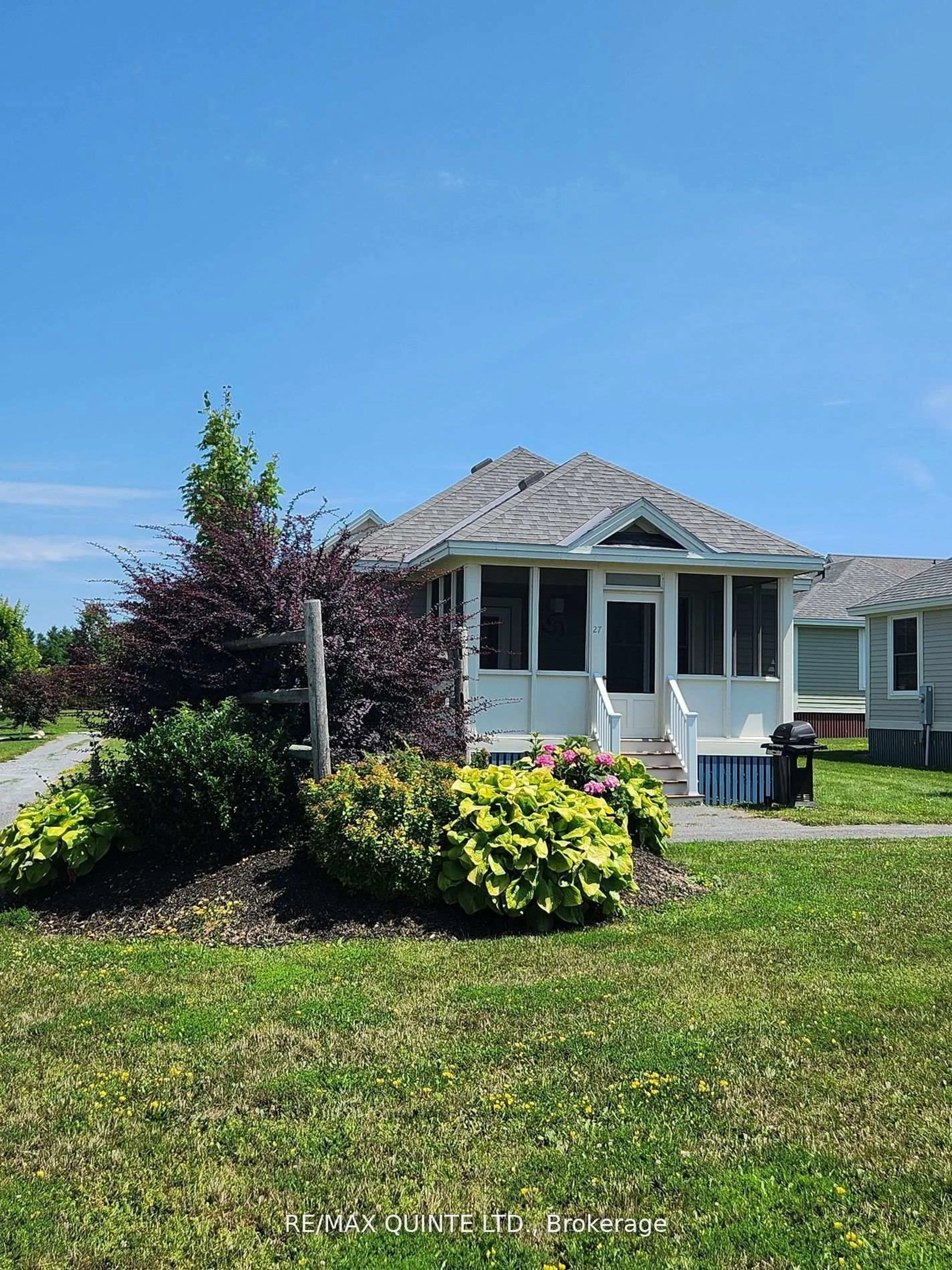 Home with vinyl exterior material, street for 27 Butternut Lane #34, Prince Edward County Ontario K0K 1P0