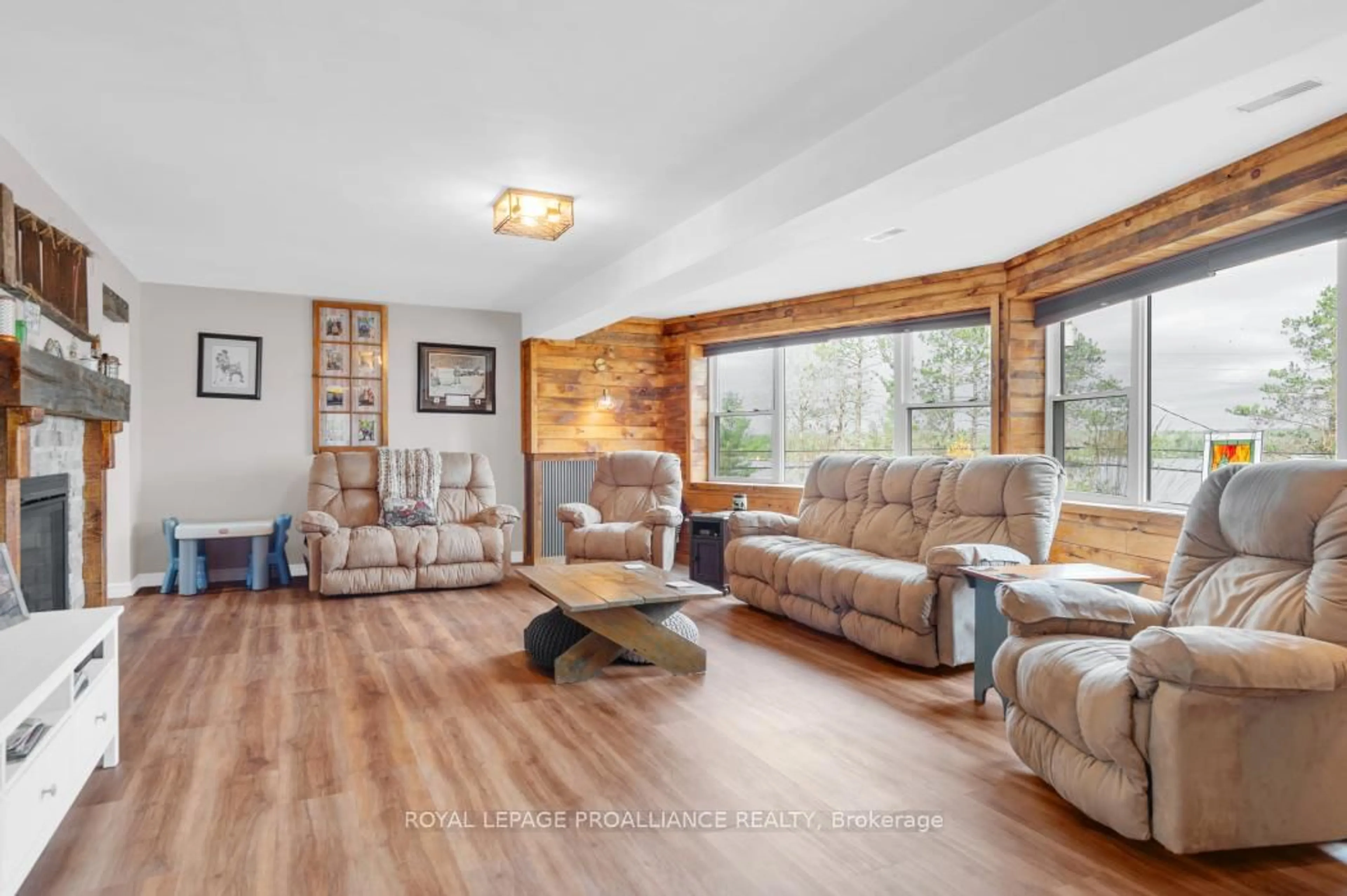 Living room with furniture, wood/laminate floor for 17206 Highway 41 N/A, Cloyne Ontario K0H 1K0