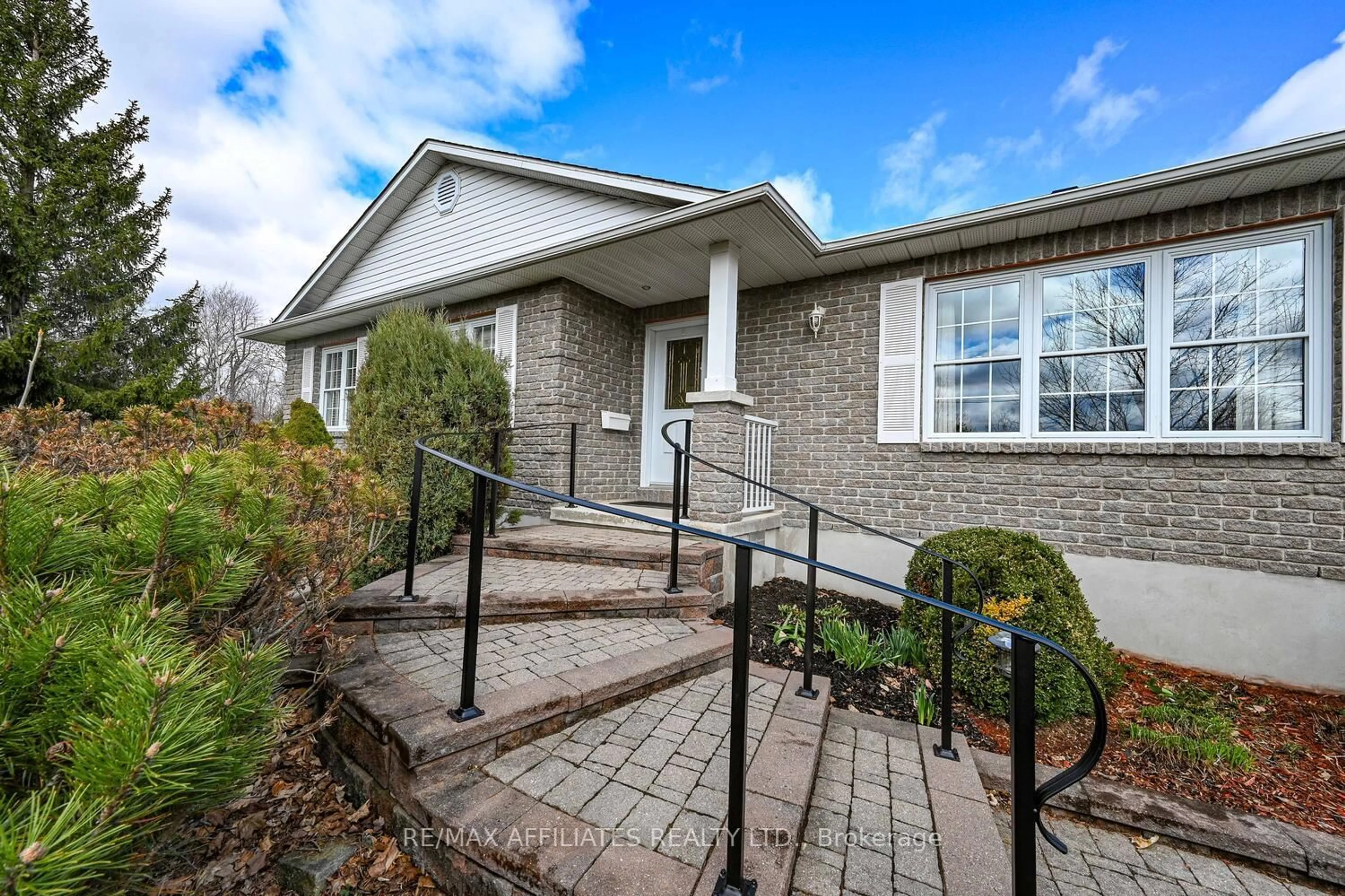Home with brick exterior material, street for 10 Tudor Circ, Rideau Lakes Ontario K0G 1L0