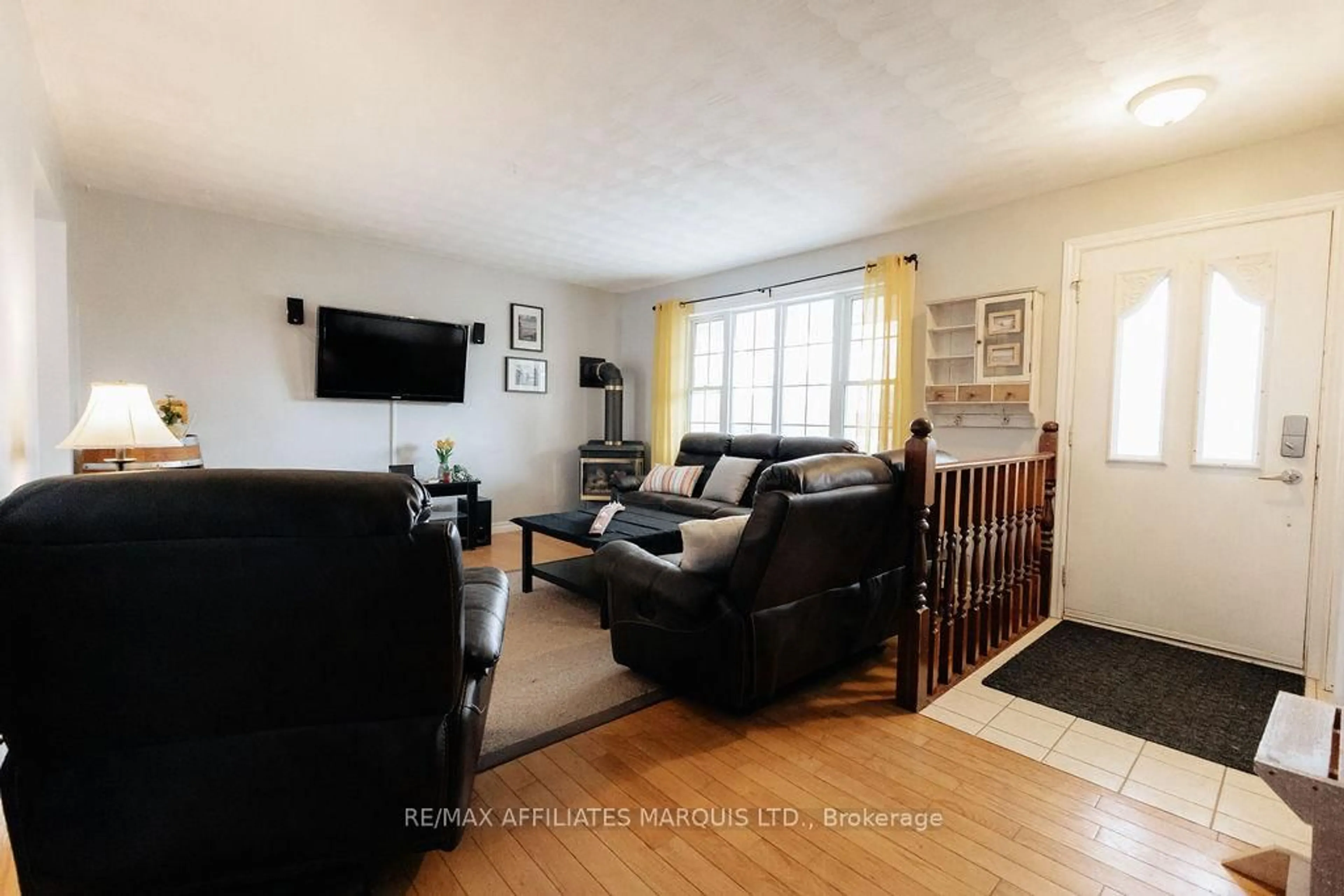 Living room with furniture, wood/laminate floor for 2423 Edgar St, Cornwall Ontario K6J 5G8