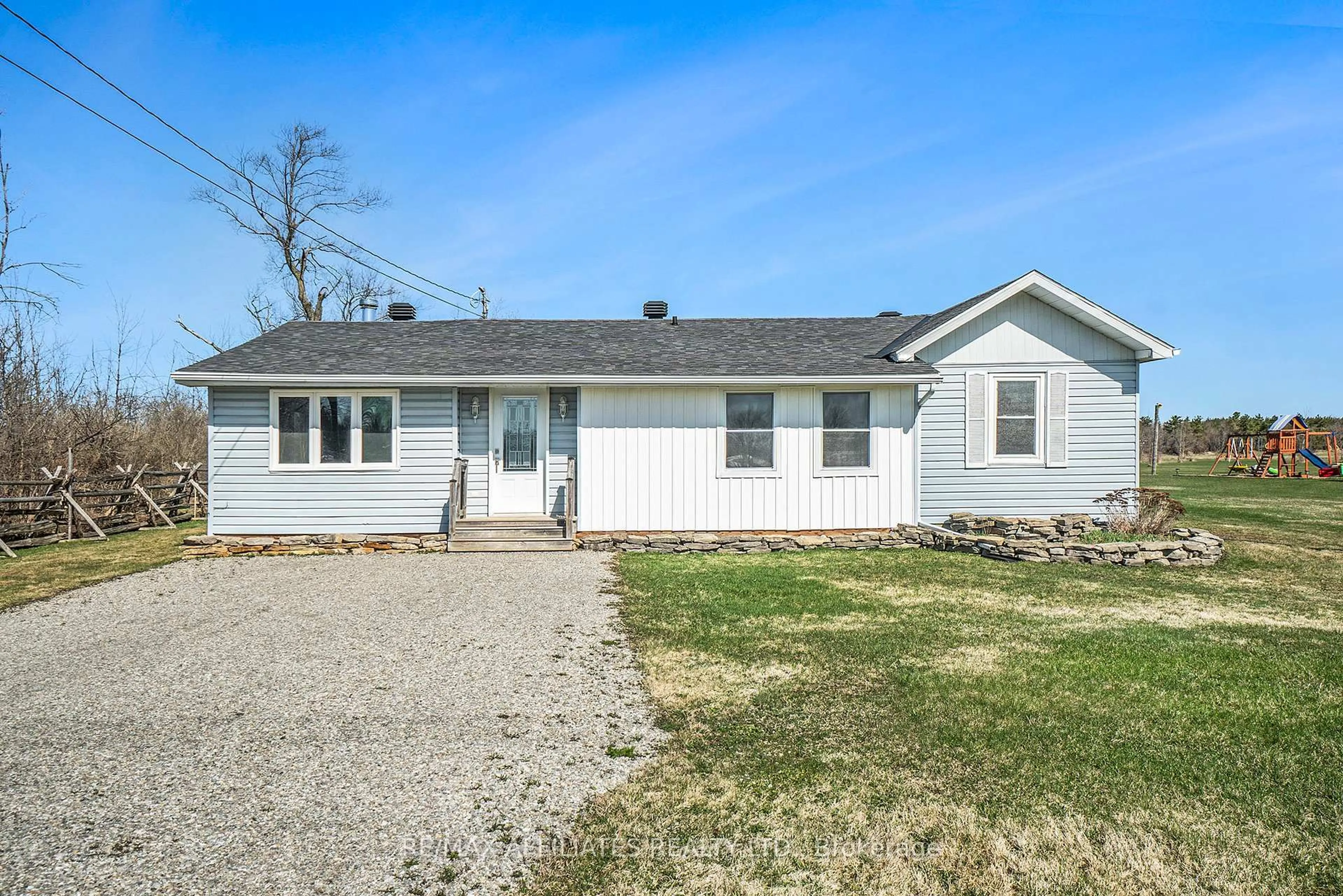 Home with vinyl exterior material, street for 568 Highway 15 Highway, Rideau Lakes Ontario K0G 1L0