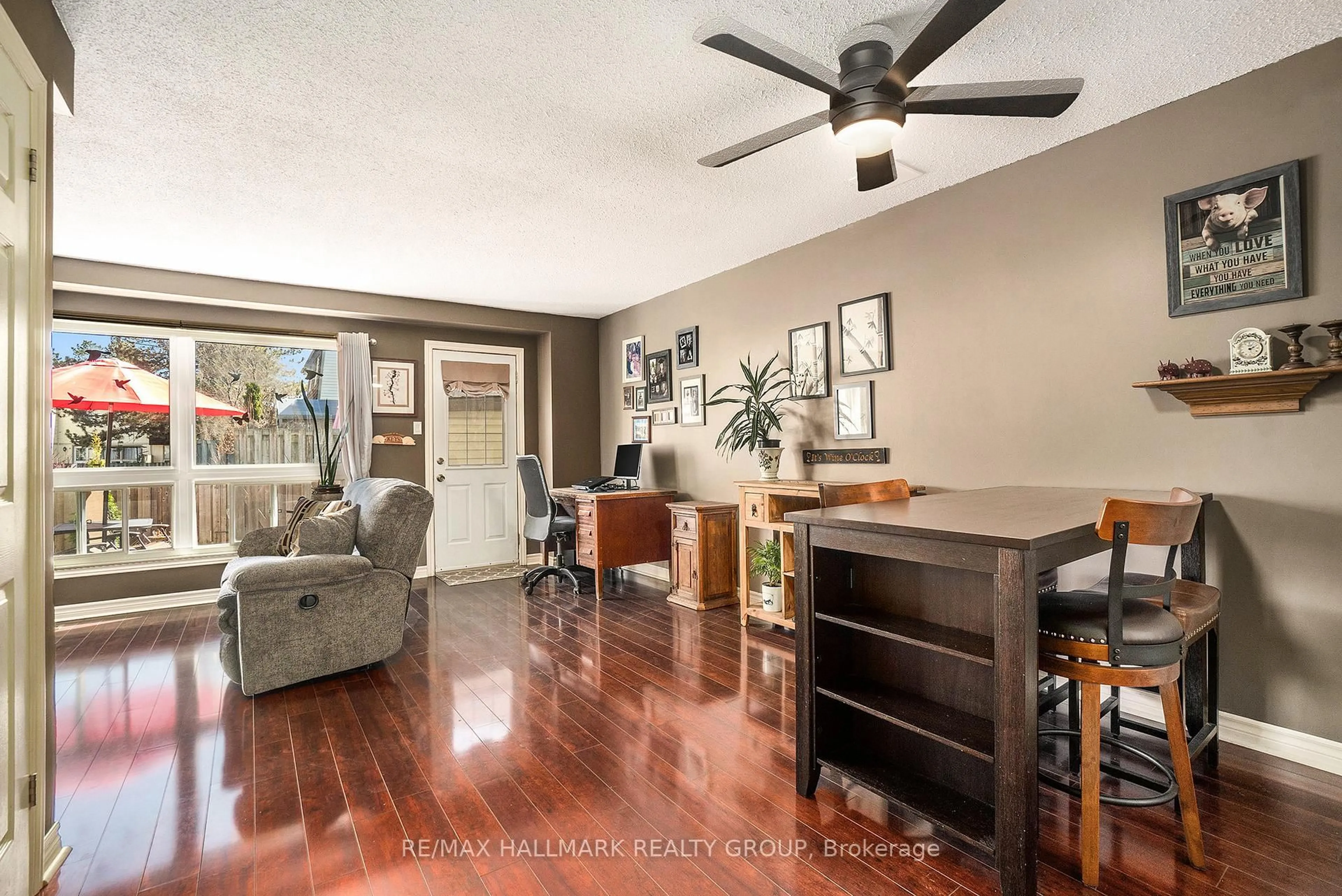 Living room with furniture, wood/laminate floor for 27 Sonnet Cres #D, Ottawa Ontario K2H 8W8