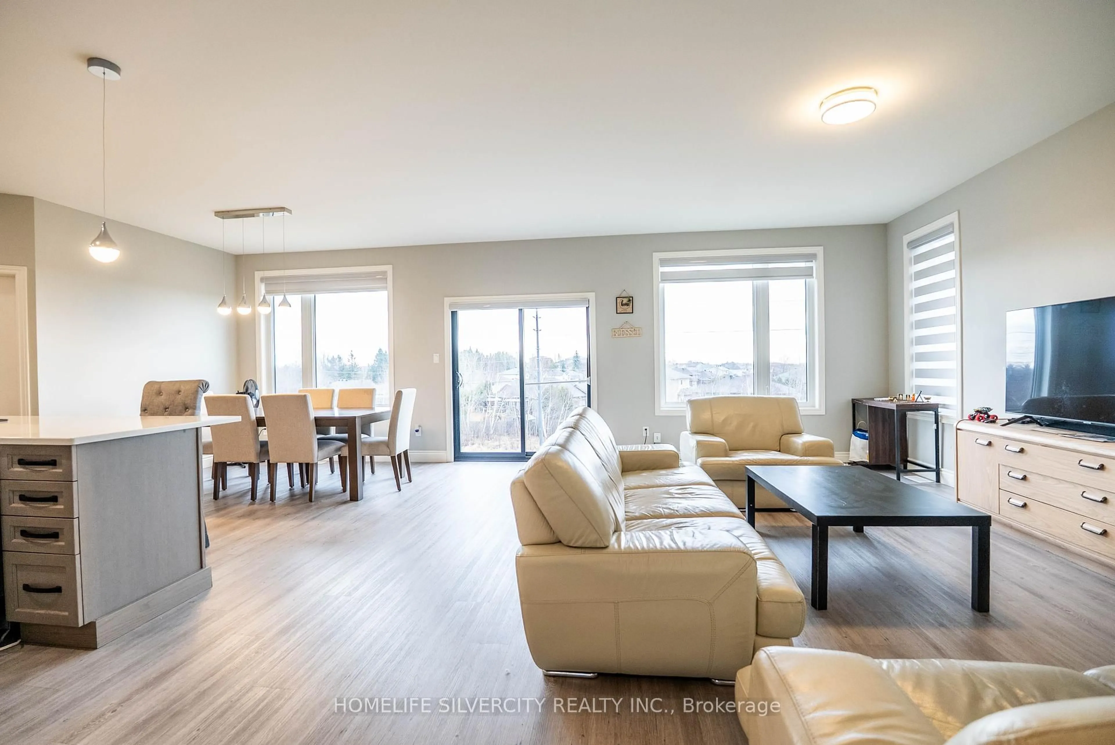 Living room with furniture, wood/laminate floor for 503 Bonaventure Crt, Greater Sudbury Ontario P3A 0B4