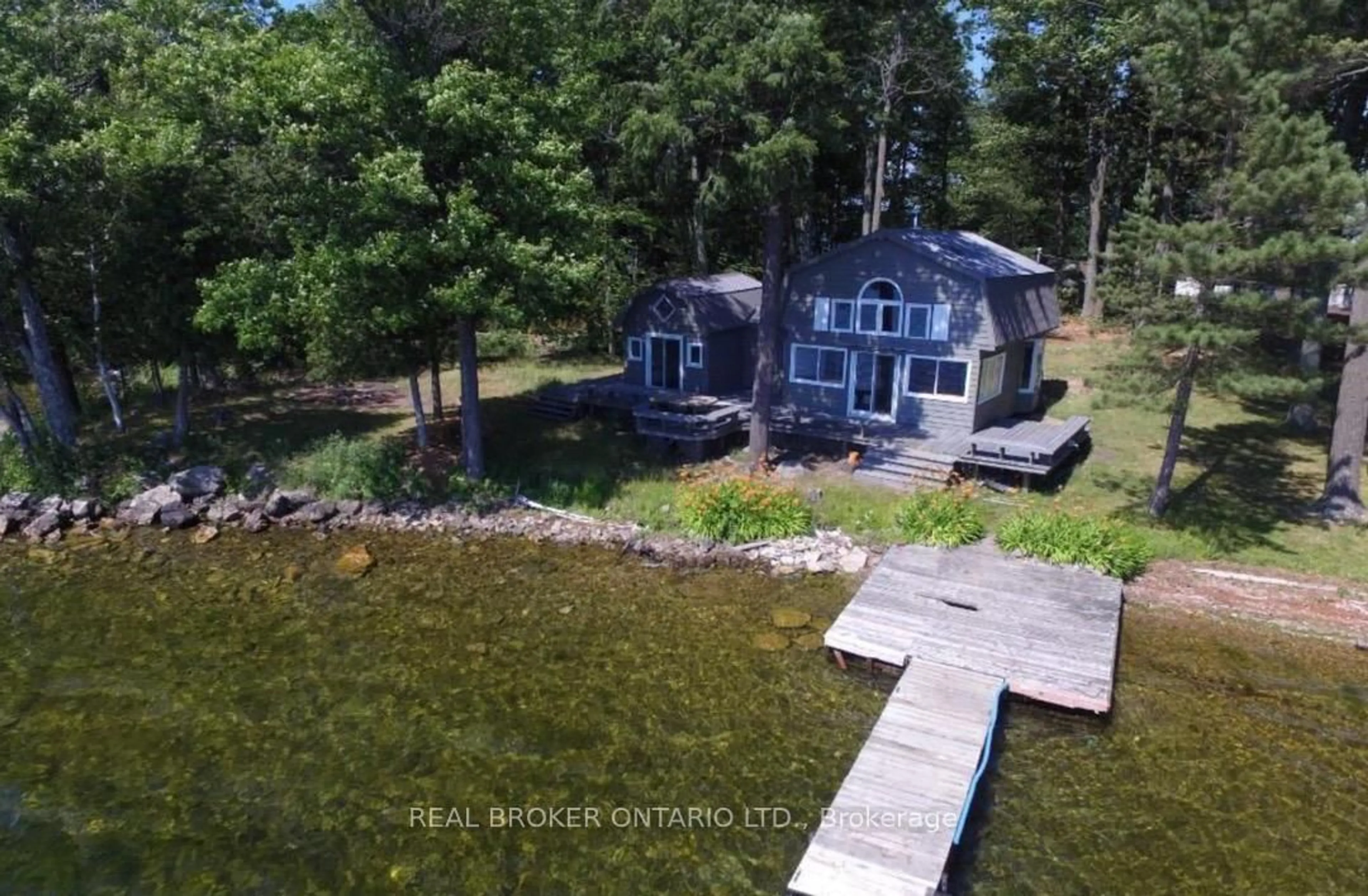 A pic from outside/outdoor area/front of a property/back of a property/a pic from drone, water/lake/river/ocean view for 101 Fairclough Island, Perth Ontario K7H 3C7