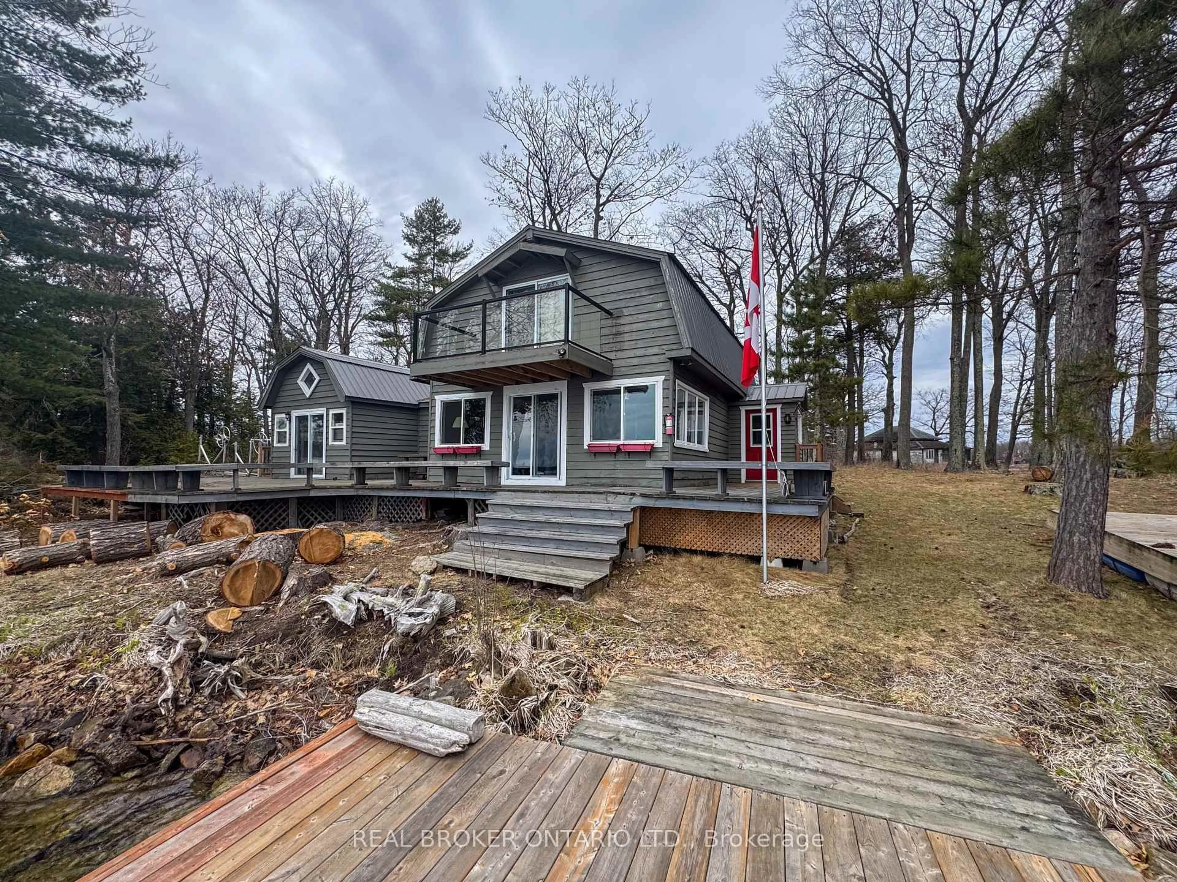 A pic from outside/outdoor area/front of a property/back of a property/a pic from drone, water/lake/river/ocean view for 101 Fairclough Island, Perth Ontario K7H 3C7