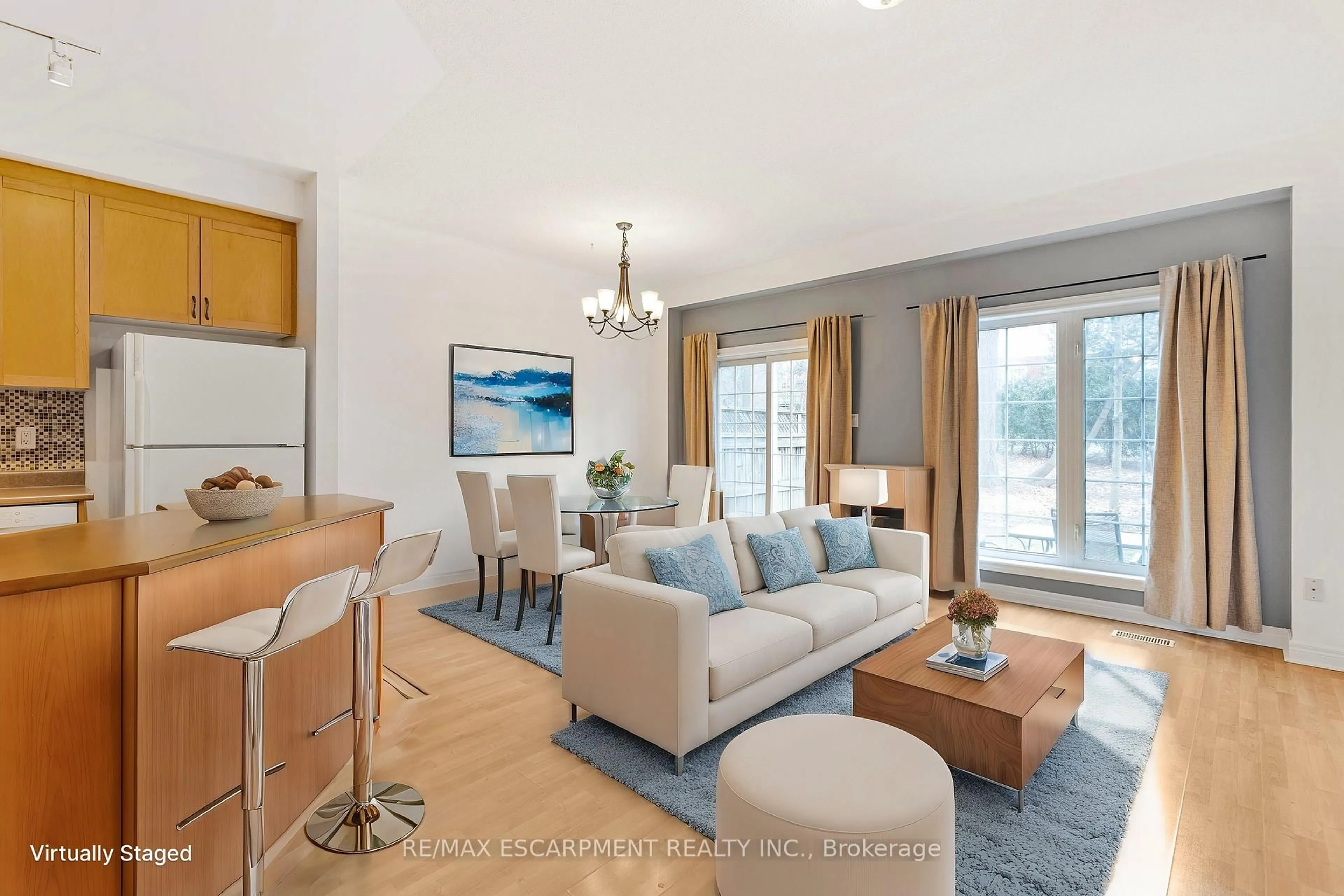 Living room with furniture, wood/laminate floor for 100 Beddoe Dr #110, Hamilton Ontario L8P 4Z2