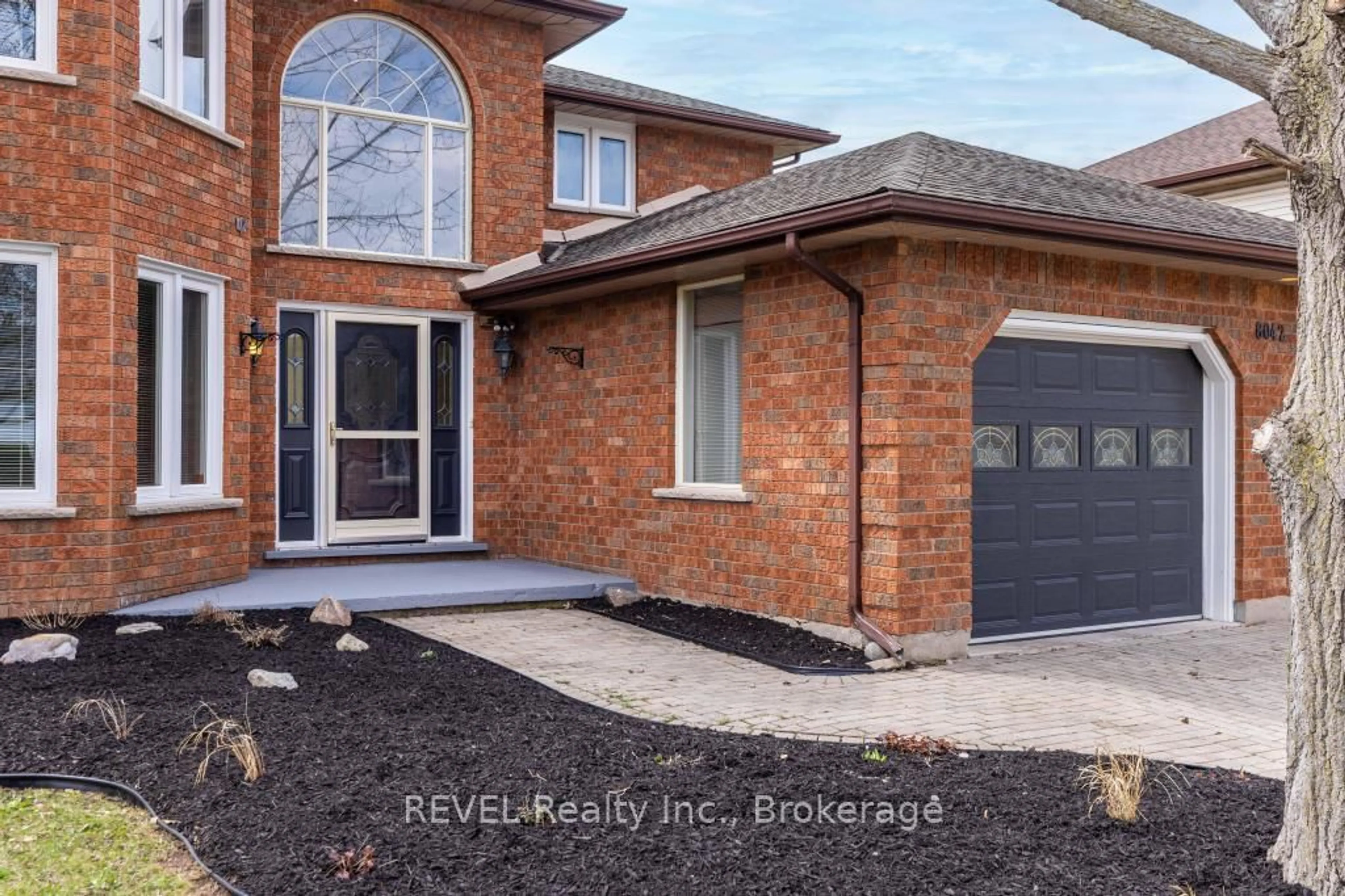 Home with brick exterior material, street for 8042 Oakridge Dr, Niagara Falls Ontario L2H 2W1