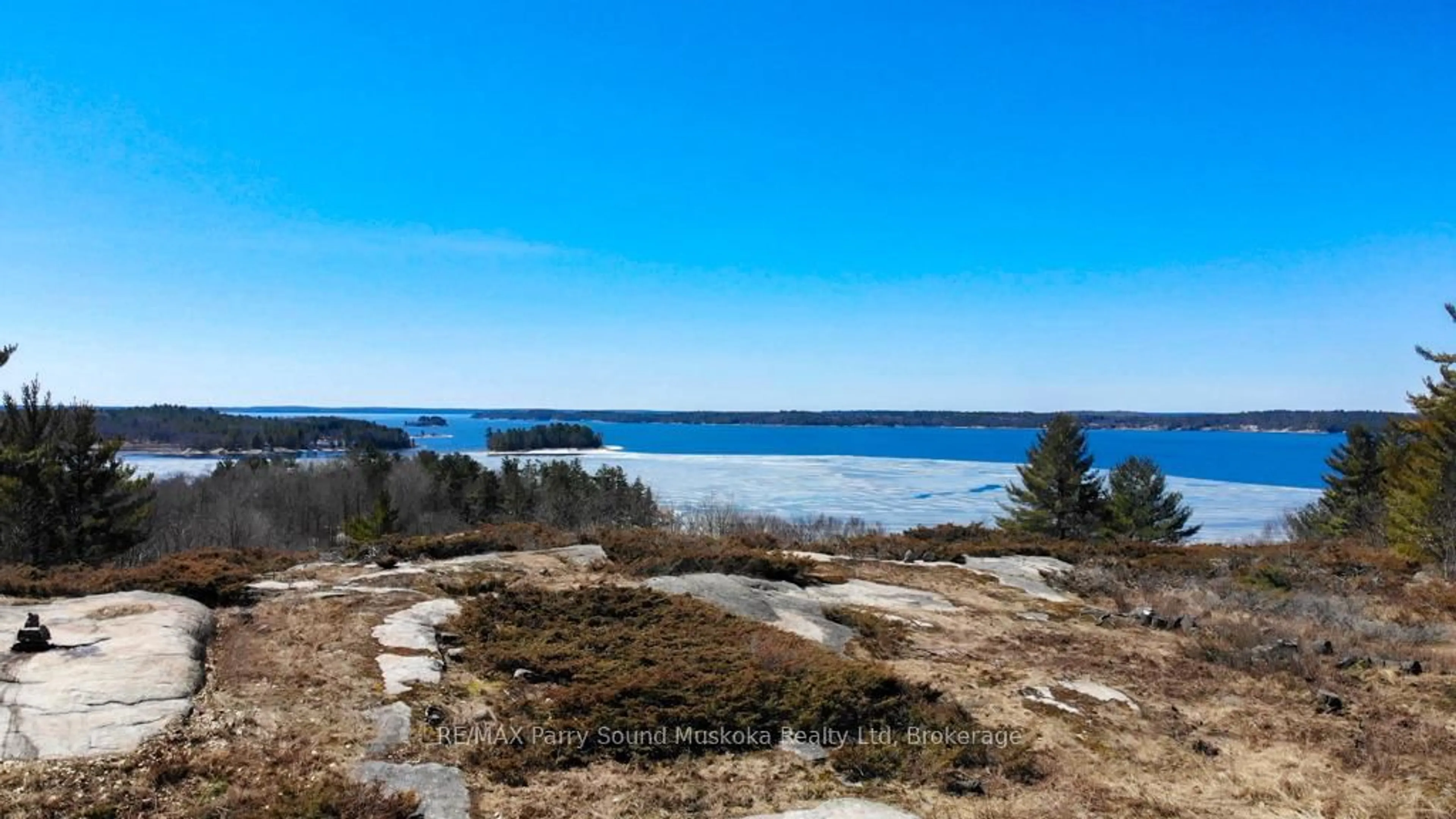 A pic from outside/outdoor area/front of a property/back of a property/a pic from drone, water/lake/river/ocean view for 20 RYDER Dr #2C, McDougall Ontario P2A 2W9