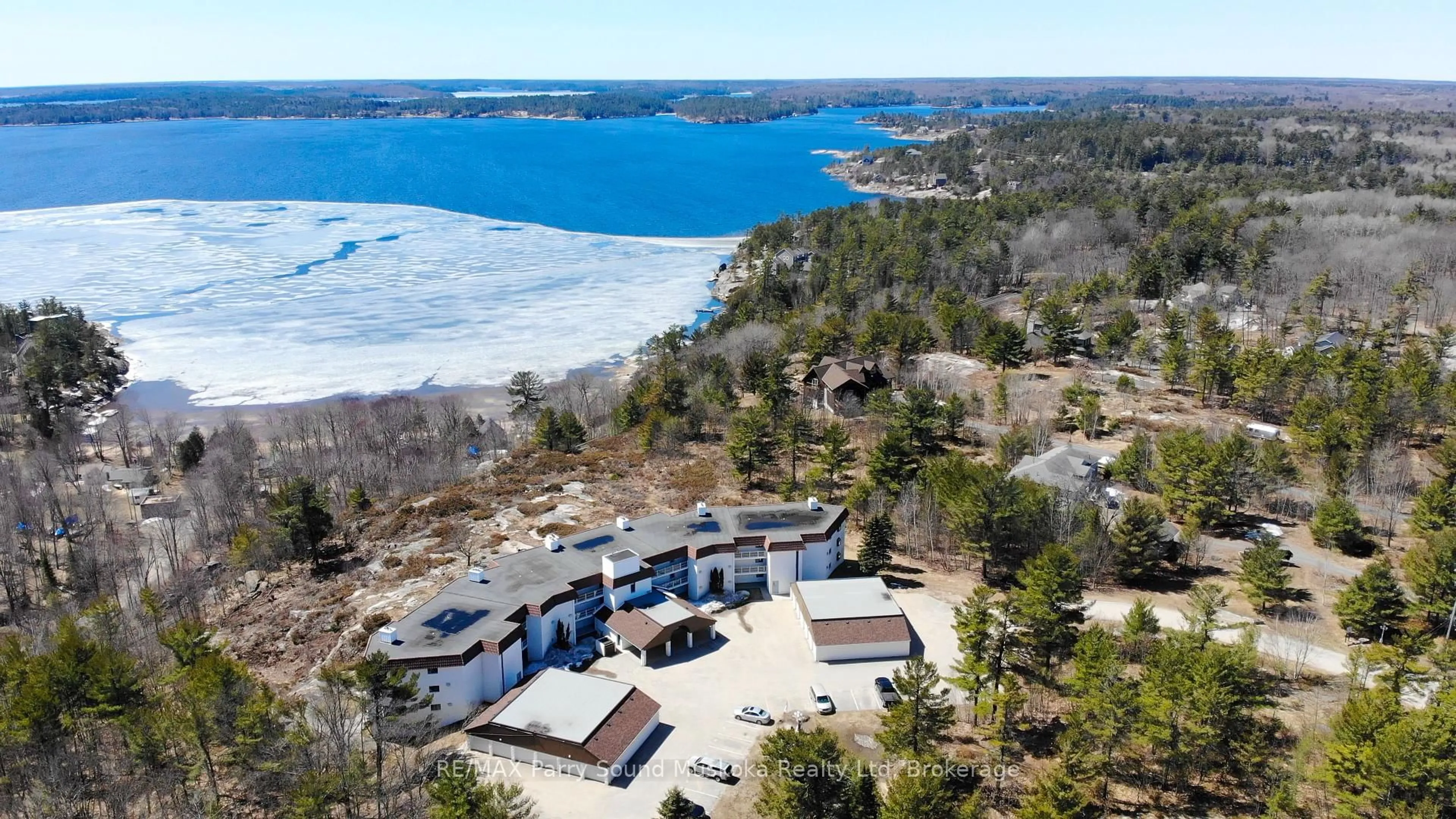 A pic from outside/outdoor area/front of a property/back of a property/a pic from drone, water/lake/river/ocean view for 20 RYDER Dr #2C, McDougall Ontario P2A 2W9