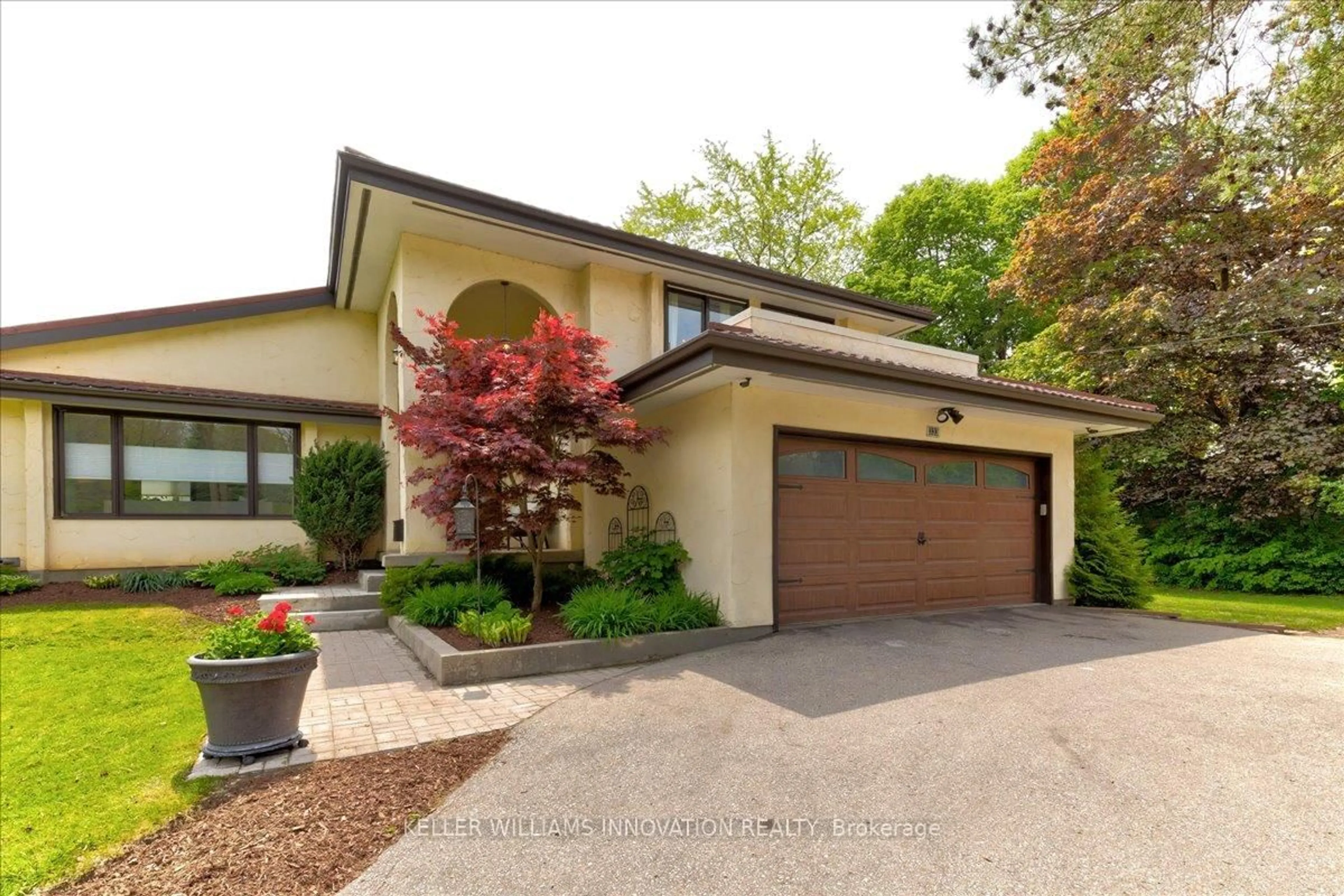Home with brick exterior material, street for 333 Woolwich St, Waterloo Ontario N2K 2K8