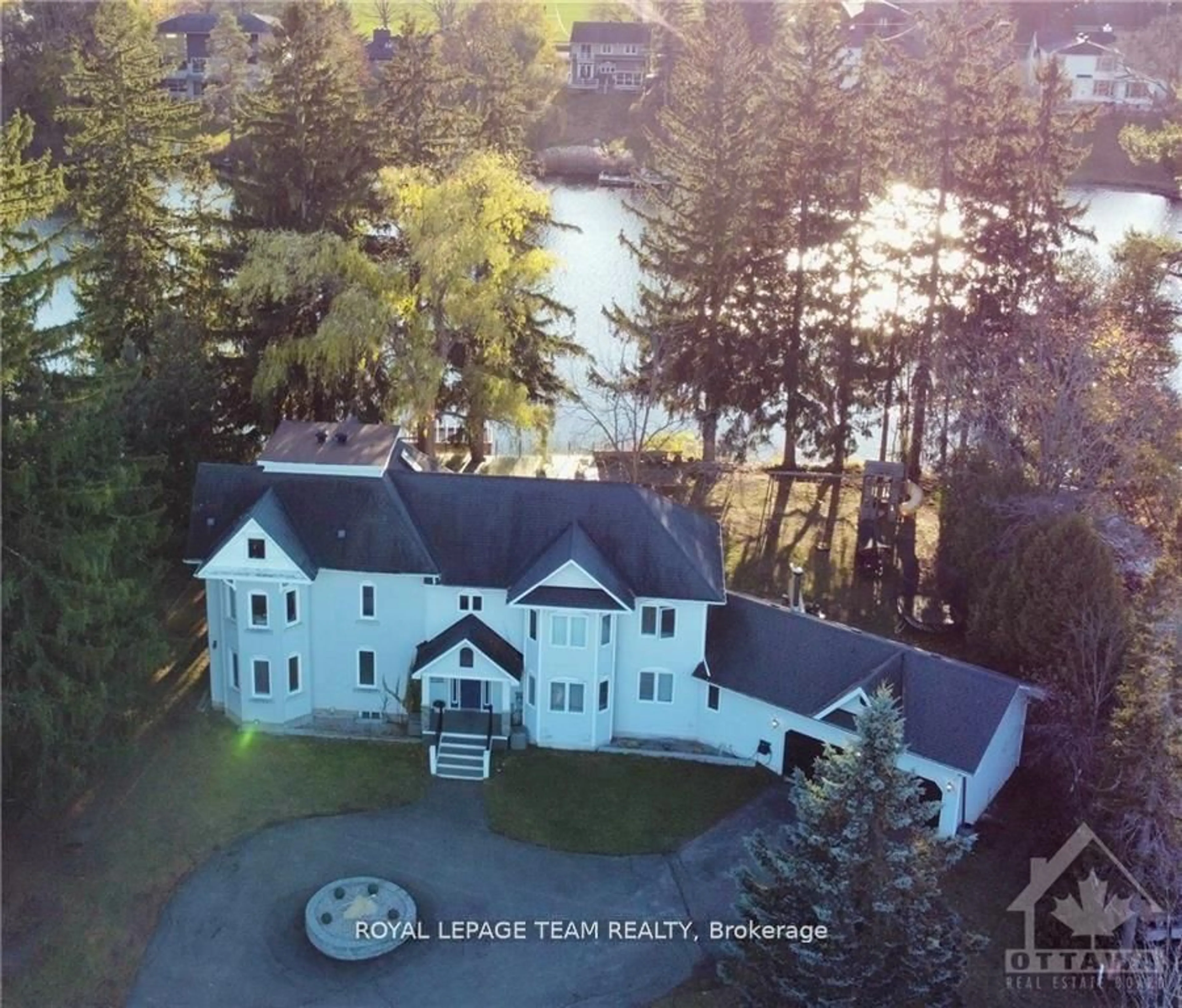 A pic from outside/outdoor area/front of a property/back of a property/a pic from drone, water/lake/river/ocean view for 5500 Old Mill Way, Manotick Ontario K4M 1C1