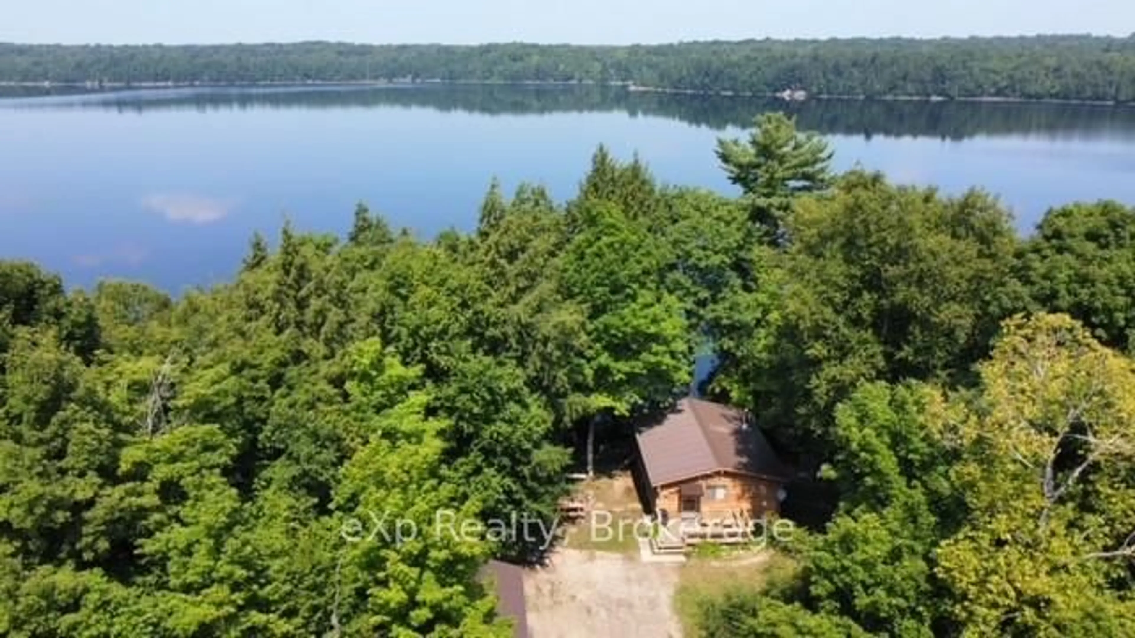 A pic from outside/outdoor area/front of a property/back of a property/a pic from drone, water/lake/river/ocean view for 180 CARIBOU Lane, Parry Sound Remote Area Ontario P0H 1S0
