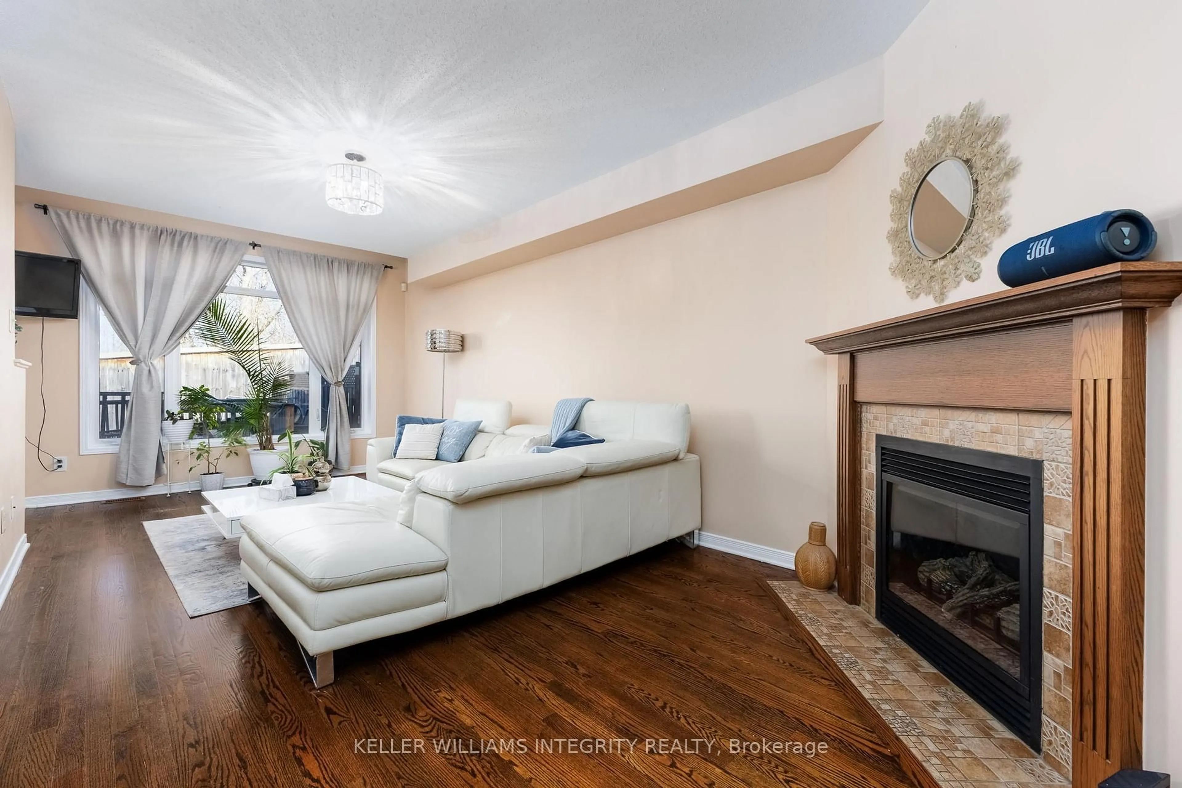 Living room with furniture, wood/laminate floor for 336 Rolling Meadow Cres, Ottawa Ontario K1W 0A7