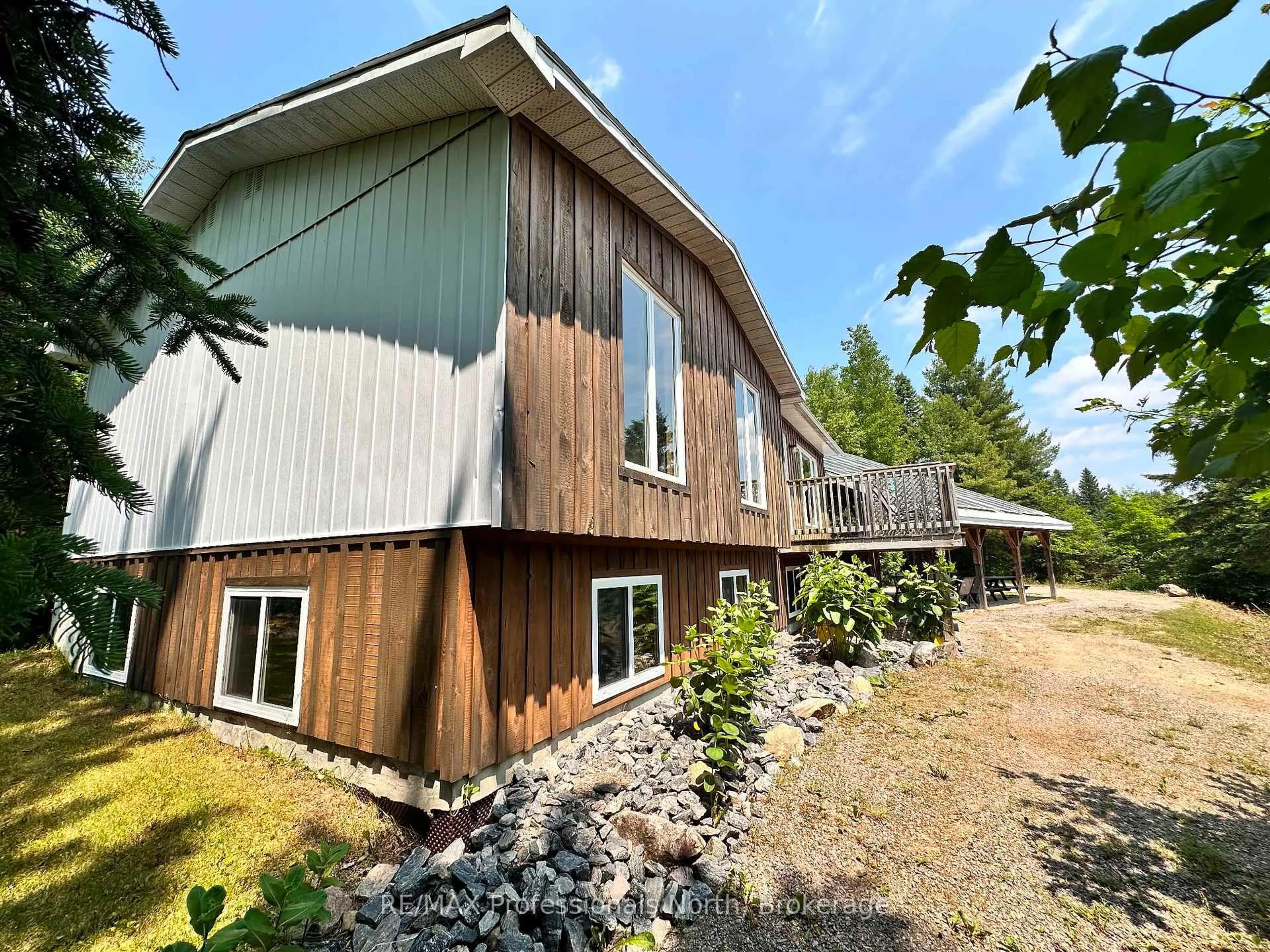 A pic from outside/outdoor area/front of a property/back of a property/a pic from drone, unknown for 10916 Highway 503 Highway, Highlands East Ontario K0M 1R0